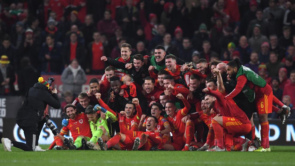 CARDIFF, WALES - NOVEMBER 19: Wales player Aaron Ramsey (front) joins in the celebrations with Gareth Bale and his team mates after the UEFA Euro 2020 qualifier between Wales and Hungary at Cardiff City Stadium on November 19, 2019 in Cardiff, Wales. (Photo by Stu Forster/Getty Images)