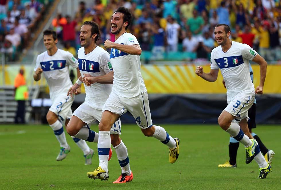 SALVADOR, BRAZIL - JUNE 30: Davide Astori of Italy celebrates the opening goal with his team-mates during the FIFA Confederations Cup Brazil 2013 3rd Place match between Uruguay and Italy at Estadio Octavio Mangabeira (Arena Fonte Nova Salvador) on June 30, 2013 in Salvador, Brazil. (Photo by Clive Mason/Getty Images)