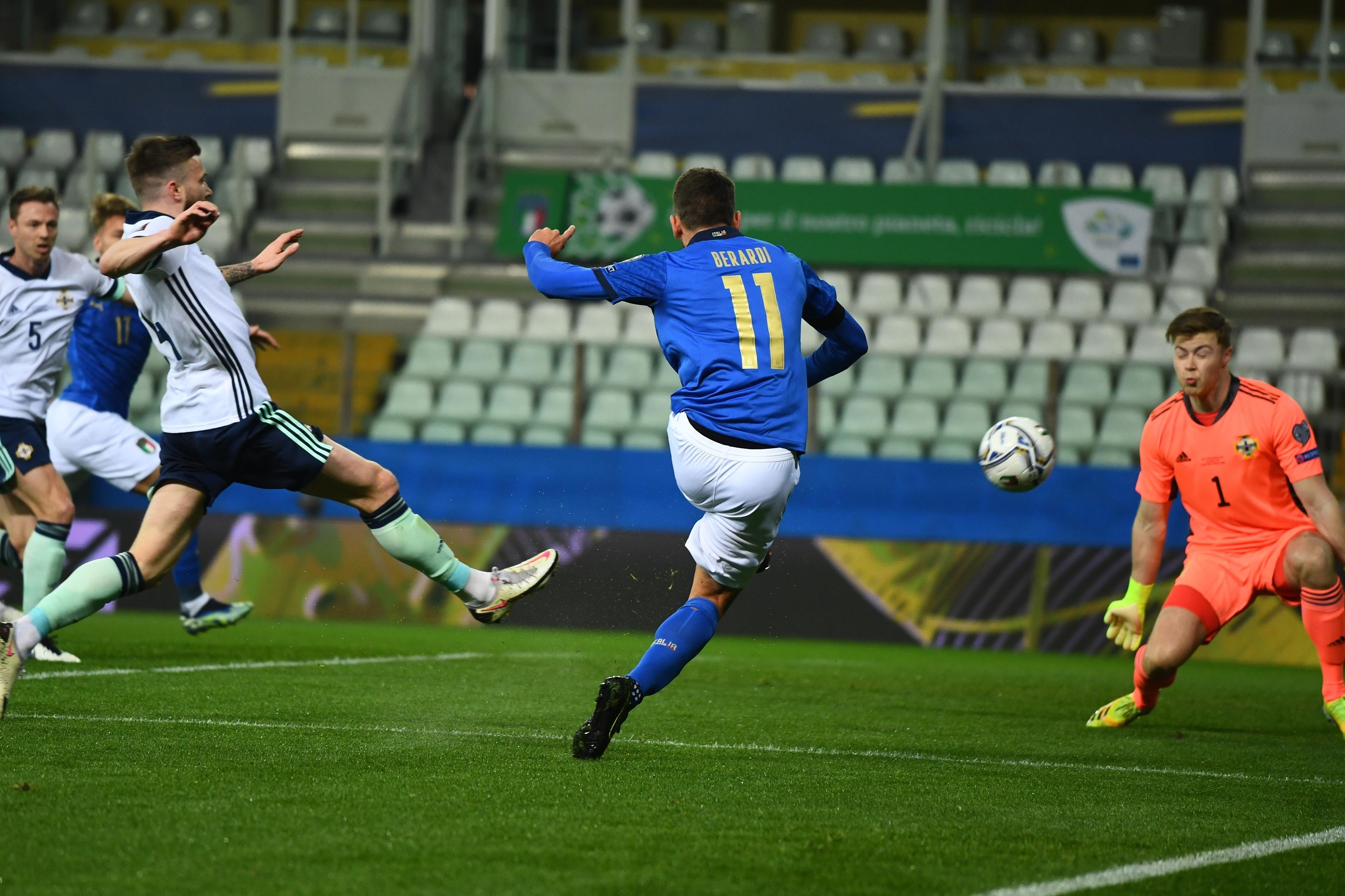 PARMA, ITALY - MARCH 25: Domenico Berardi of Italy scores the opening goal during the FIFA World Cup 2022 Qatar qualifying match between Italy and Northern Ireland on March 25, 2021 in Parma, Italy. Sporting stadiums around Italy remain under strict restrictions due to the Coronavirus Pandemic as Government social distancing laws prohibit fans inside venues resulting in games being played behind closed doors. (Photo by Claudio Villa/Getty Images)