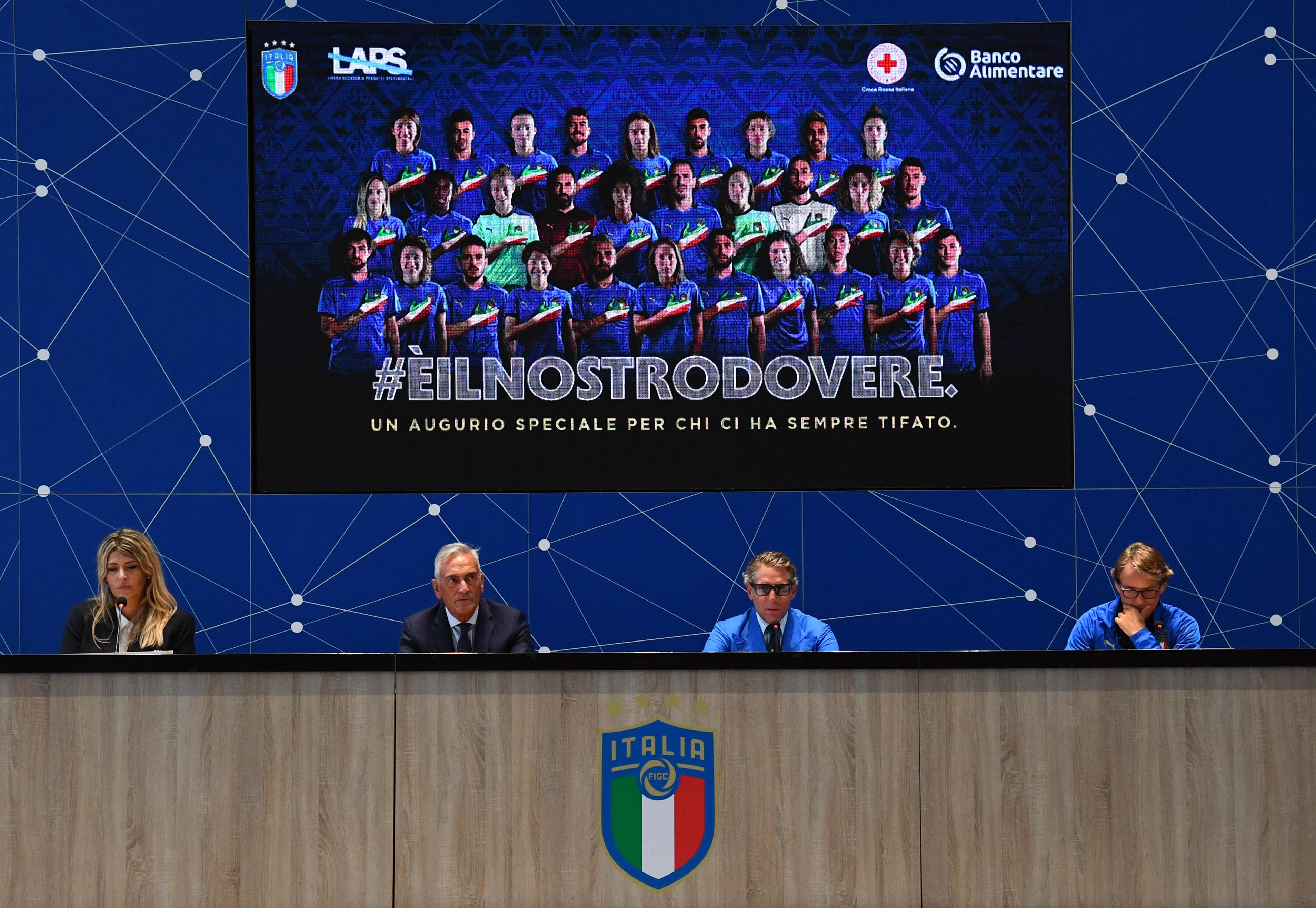 FLORENCE, ITALY - AUGUST 30: Head coach Italy Roberto Mancini, President Laps Lapo Elkann and President FIGC Gabriele Gravina speak with the media during a press conference (Uefa awarded Figc and Laps Foundation for #eilnostrodovere campaign in favour of Covid emergency) at Centro Tecnico Federale di Coverciano on August 30, 2021 in Florence, Italy. (Photo by Claudio Villa/Getty Images)