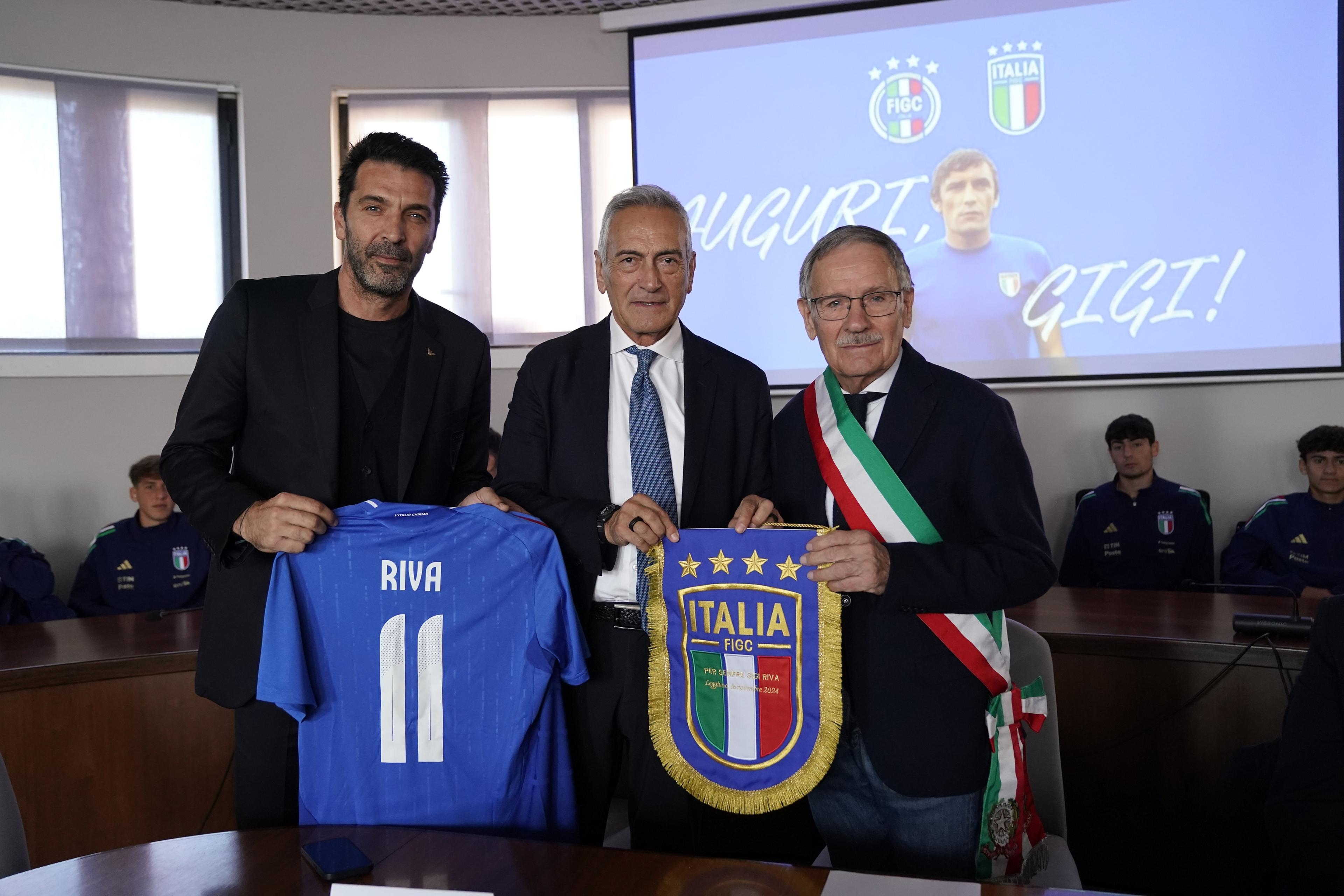 VARESE, ITALY - NOVEMBER 16:  Gianluigi Buffon, Gabriele Gravina President of FIGC and Giovanni Parmigiani Mayor of Leggiuno pose for a photo during the event of Italy Under 18 and DCPS on November 16, 2024 in Varese, Italy. (Photo by FIGC/FIGC via Getty Images)