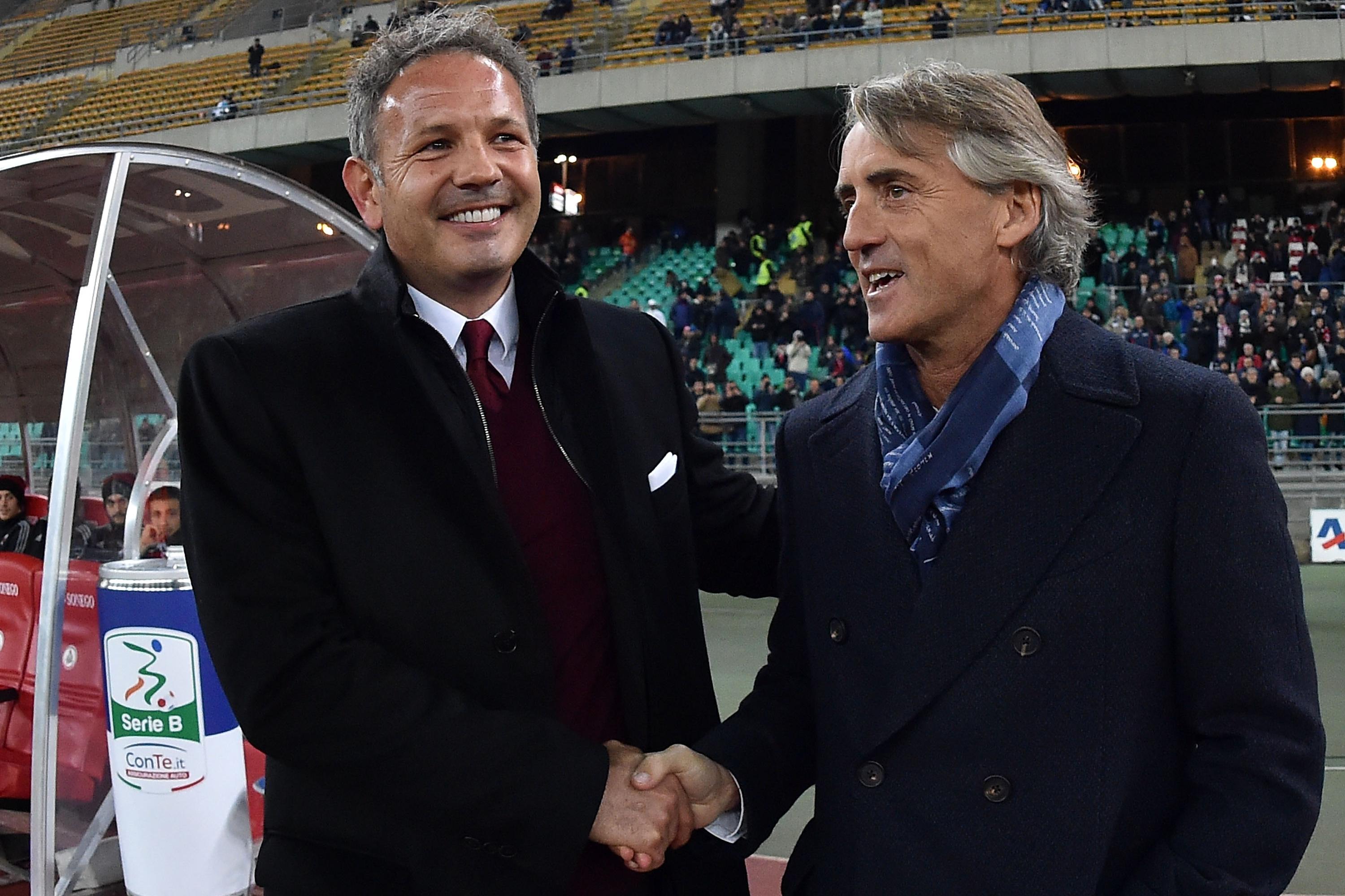 BARI, ITALY - NOVEMBER 24:  Head coach of AC Milan Sinisa Mihajlovic and head coach of FC Internazionale Roberto Mancini shake hands before a tournament between FC Internazionale, AC Milan and AS Bari at Stadio San Nicola on November 24, 2015 in Bari, Italy.  (Photo by Giuseppe Bellini/Getty Images)