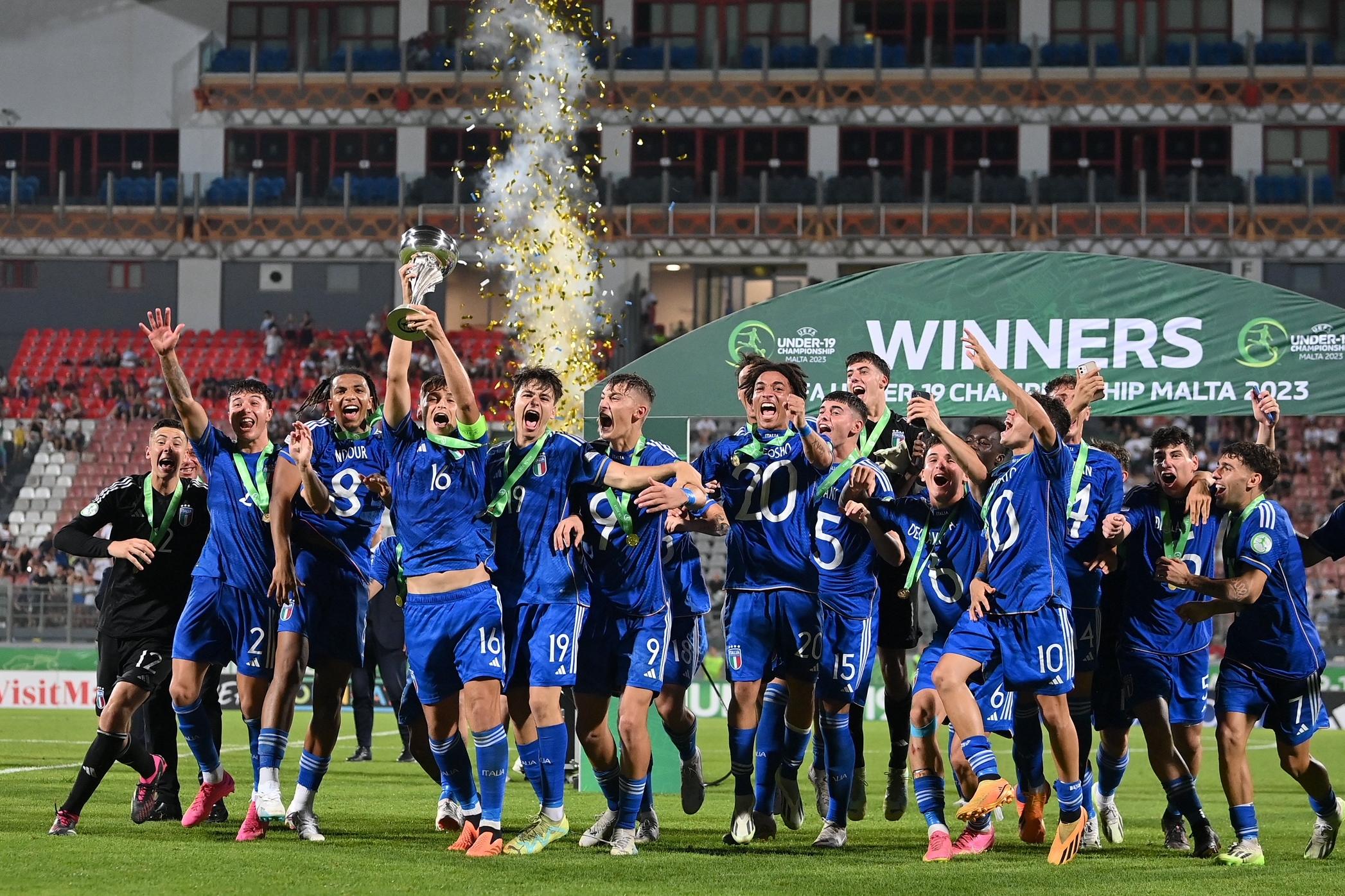 TA\\' QALI, MALTA - JULY 16: Giacomo Faticanti of Italy lifts the trophy after the UEFA European Under-19 Championship 2022/23 final match between Portugal and Italy at the National Stadium on July 16, 2023 in Ta\\' Qali, Malta. (Photo by Seb Daly - Sportsfile/UEFA via Getty Images)