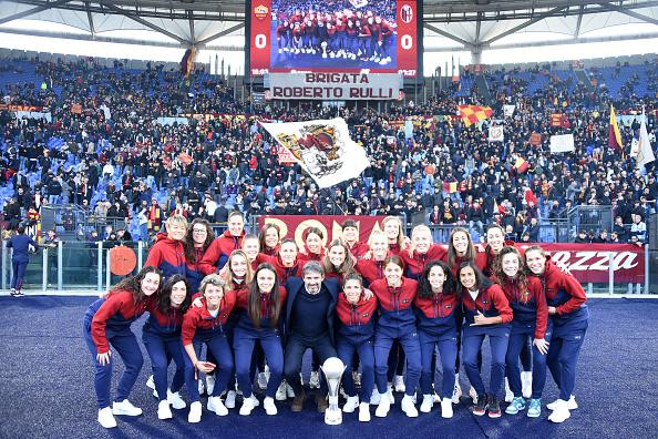 Roma woman players pose under fans with the Italian super cup during the match Roma v Bologna at the Stadio Olimpico. Rome (Italy), January 04th, 2023 (Photo by Massimo Insabato/Archivio Massimo Insabato/Mondadori Portfolio via Getty Images)
