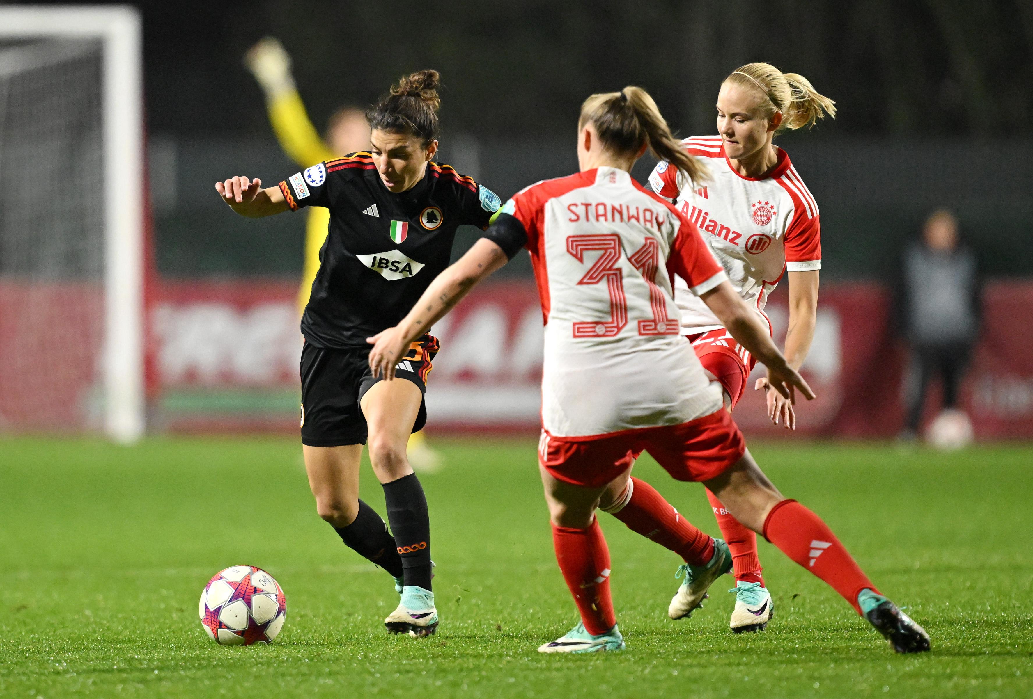 ROME, ITALY - JANUARY 24: Elisa Bartoli of AS Roma runs with the ball whilst under pressure from Georgia Stanway of Bayern Munich during the UEFA Women's Champions League group stage match between AS Roma and FC Bayern MÃ¼nchen at Stadio Tre Fontane on January 24, 2024 in Rome, Italy. (Photo by Tullio Puglia - UEFA/UEFA via Getty Images)