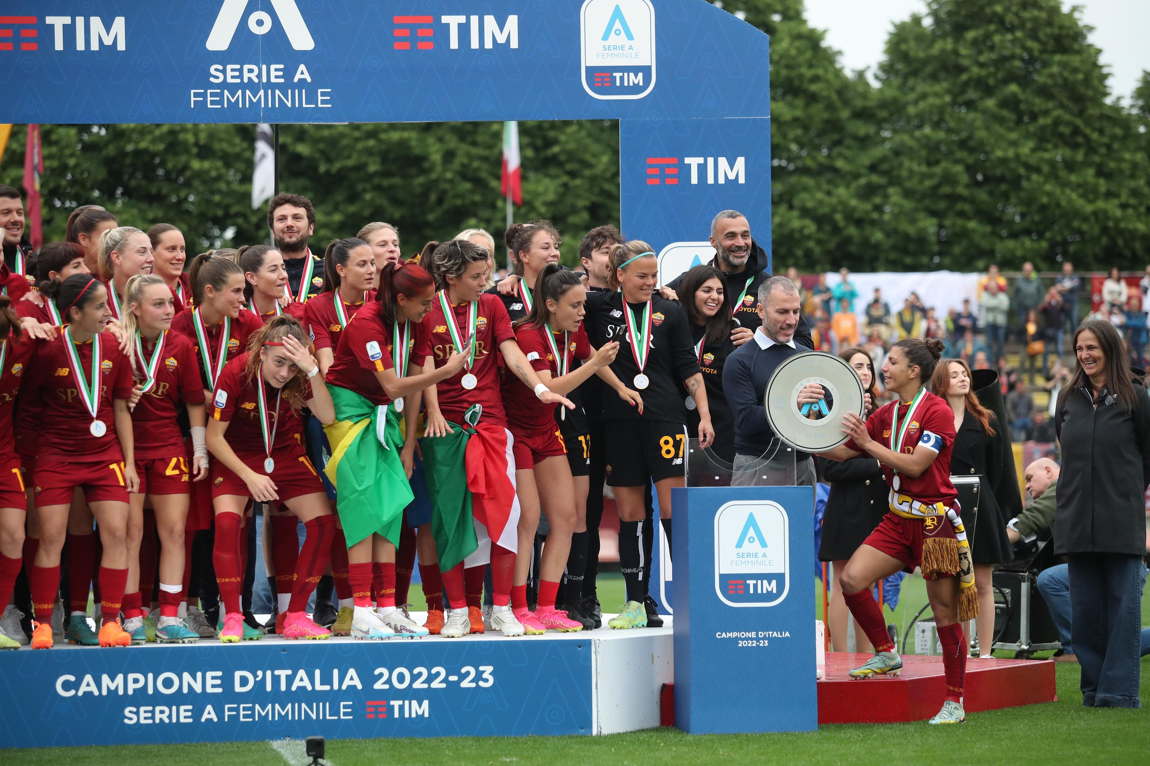 ROME, ITALY - MAY 20: TIm Ceo Pietro Labriola and Seria A women President Ludovica Mantovani hold the trophy with Elisa Bartoli of AS Roma women after winning the Women Serie A champioship after the Women Serie A Playoffs match between AS Roma and FC Internazionale at Stadio Tre Fontane on May 20, 2023 in Rome, Italy. (Photo by Paolo Bruno/Getty Images)
