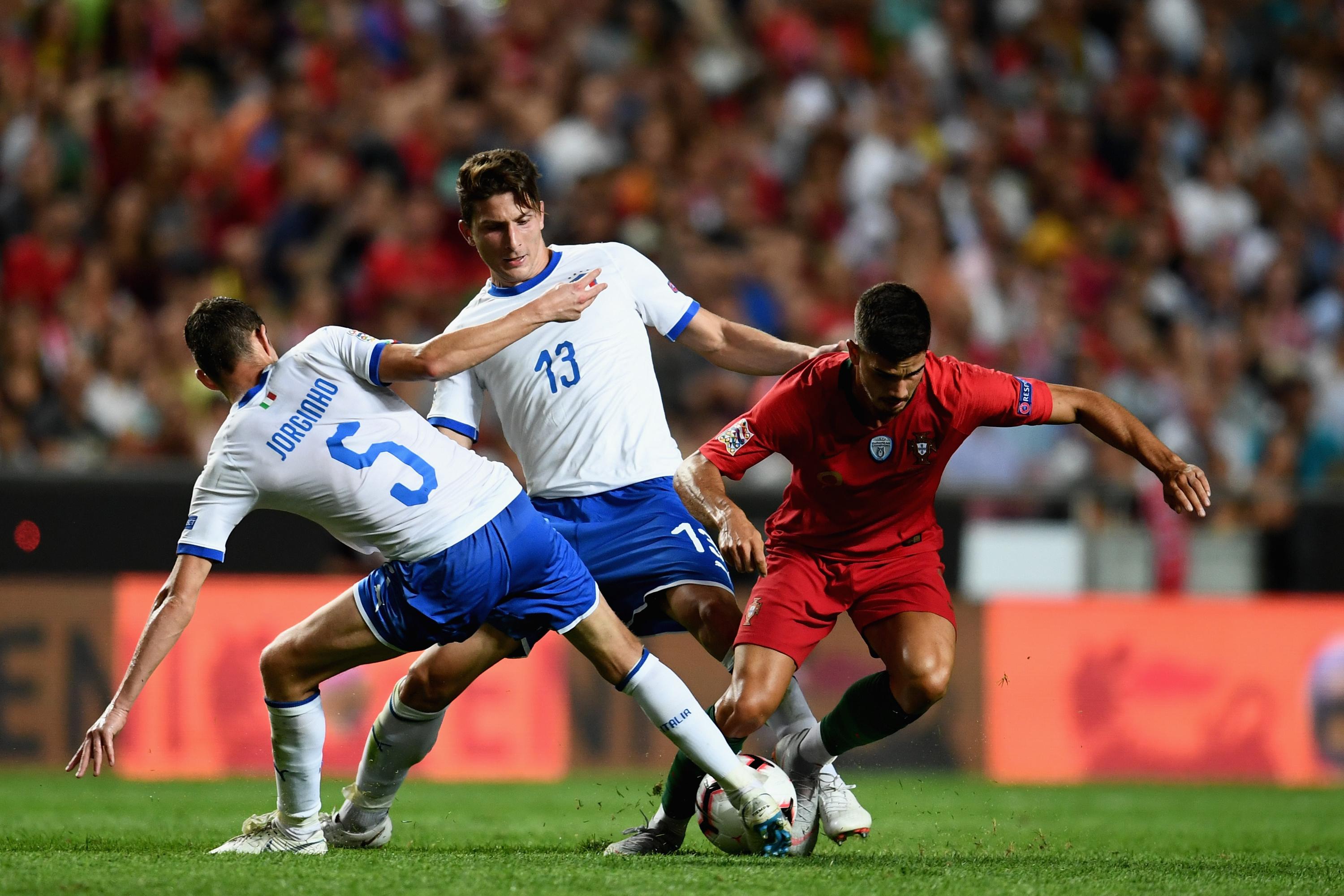 LISBON, PORTUGAL - SEPTEMBER 10: Jorginho of Italy (L) competes for the ball with Andre Silva of Portugal during the UEFA Nations League A group three match between Portugal and Italy at on September 10, 2018 in Lisbon, Portugal. (Photo by Claudio Villa/Getty Images)