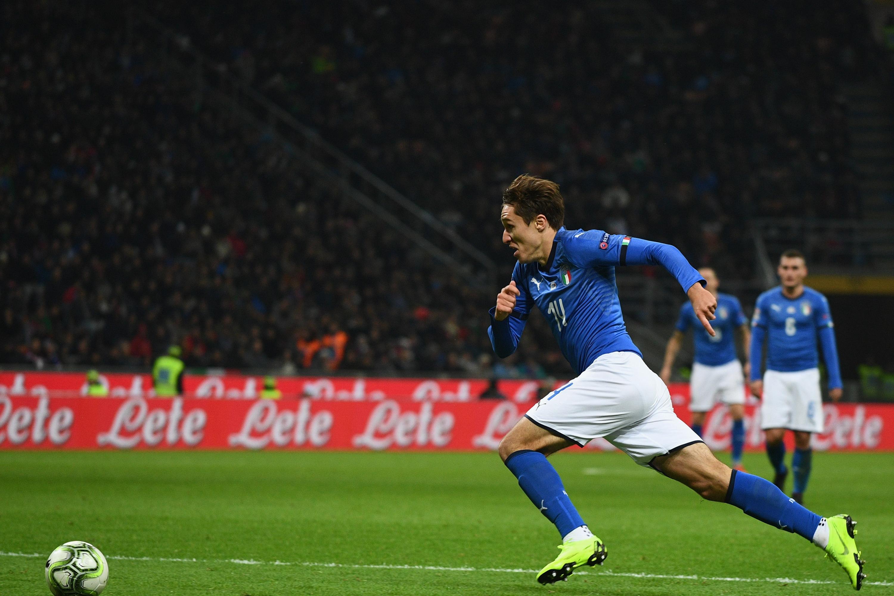 MILAN, ITALY - NOVEMBER 17: Federico Chiesa of Italy #14 in action during the UEFA Nations League A group three match between Italy and Portugal at Stadio Giuseppe Meazza on November 17, 2018 in Milan, Italy. (Photo by Claudio Villa/Getty Images)