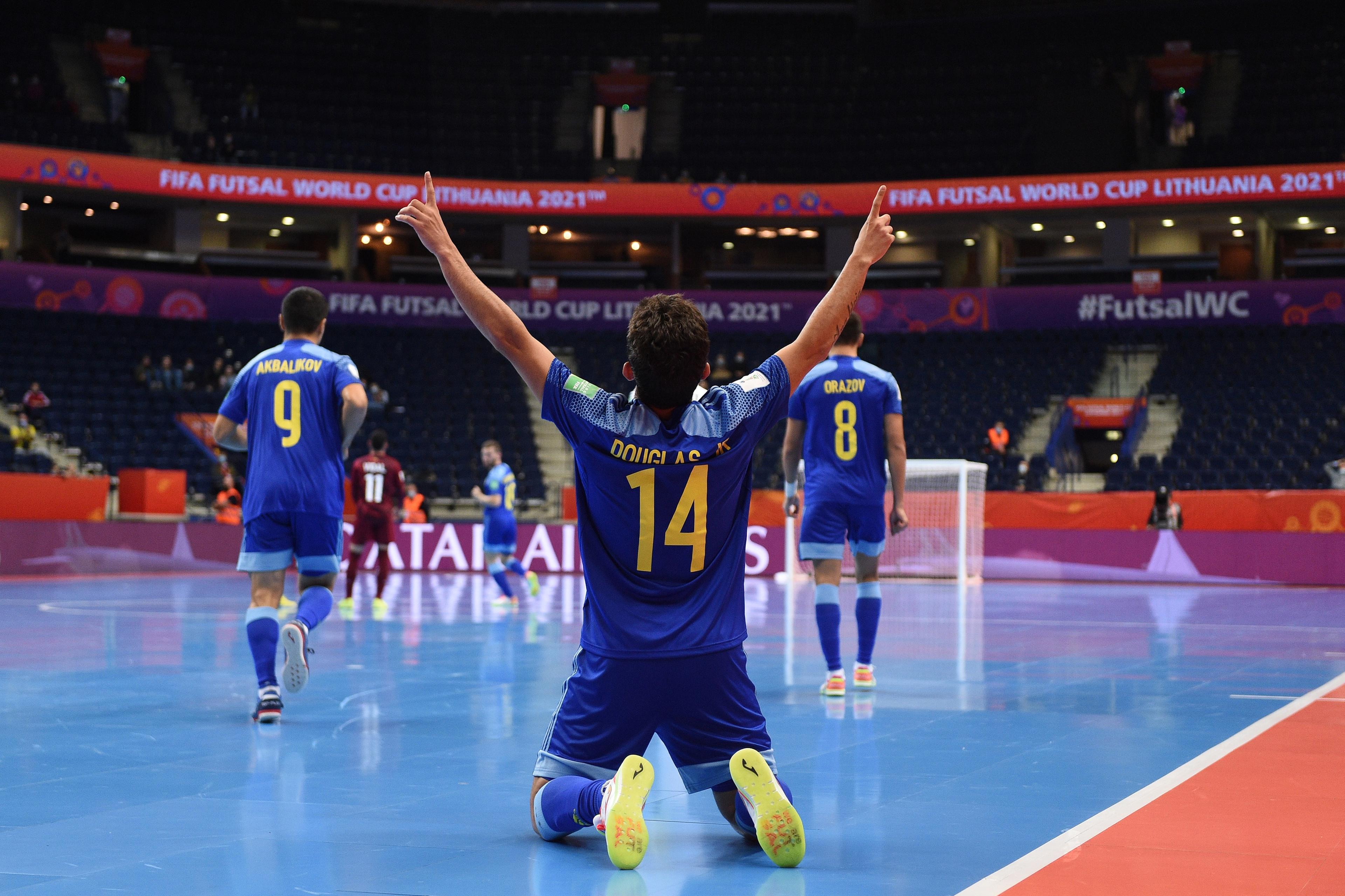 VILNIUS, LITHUANIA - SEPTEMBER 18: Jr. Douglas of Kazakhstan celebrates scoring his teams first goal of the match during the FIFA Futsal World Cup 2021 group A match between Venezuela and Kazakhstan at Vilnius Arena on September 18, 2021 in Vilnius, Lithuania. (Photo by Alex Caparros - FIFA/FIFA via Getty Images)