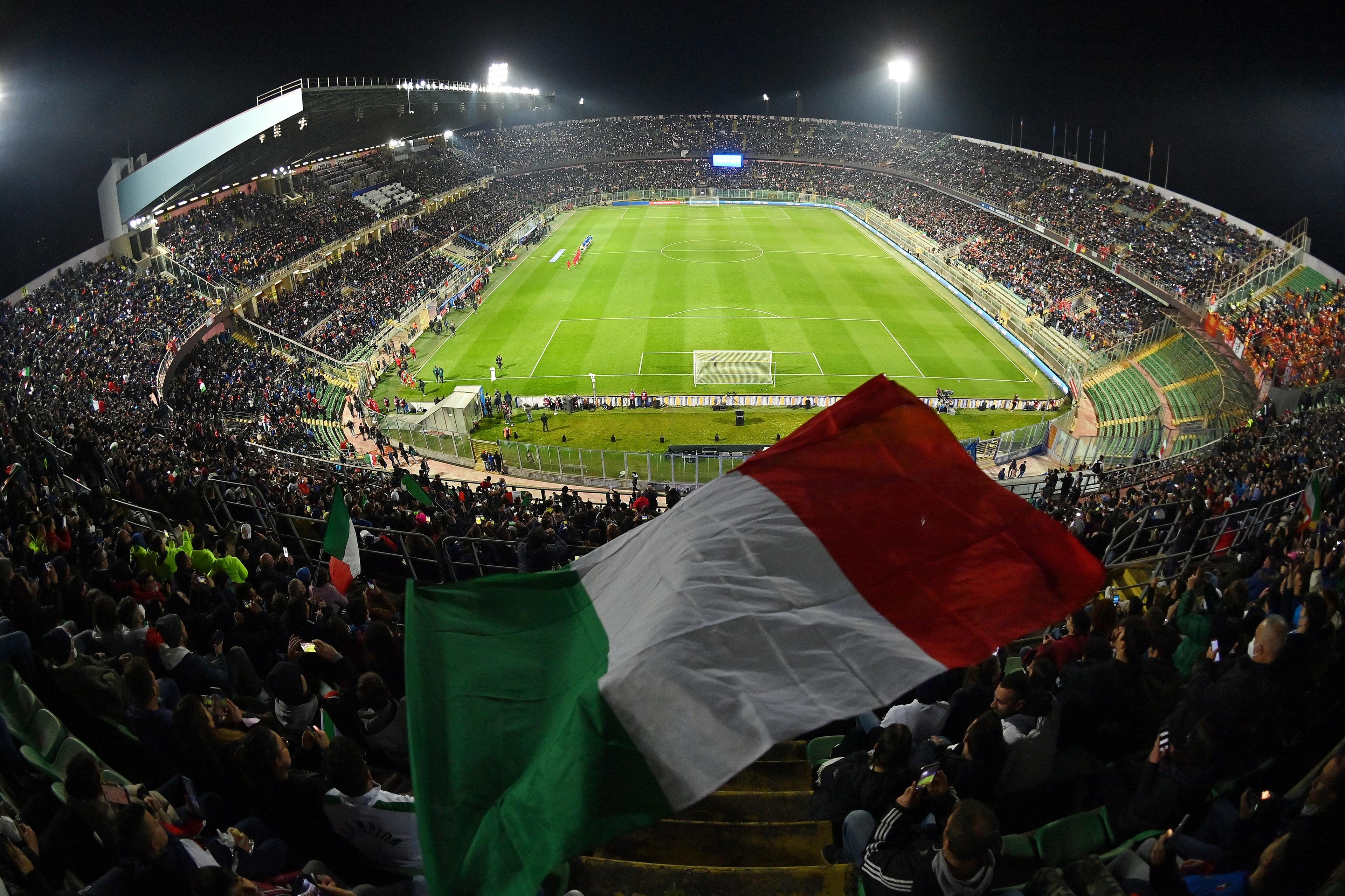 PALERMO, ITALY - MARCH 24: A general view inside the stadium as a fan waves the flag of Italy prior to the 2022 FIFA World Cup Qualifier knockout round play-off match between Italy and North Macedonia at Stadio Renzo Barbera on March 24, 2022 in Palermo, Italy. (Photo by Tullio M. Puglia/Getty Images)