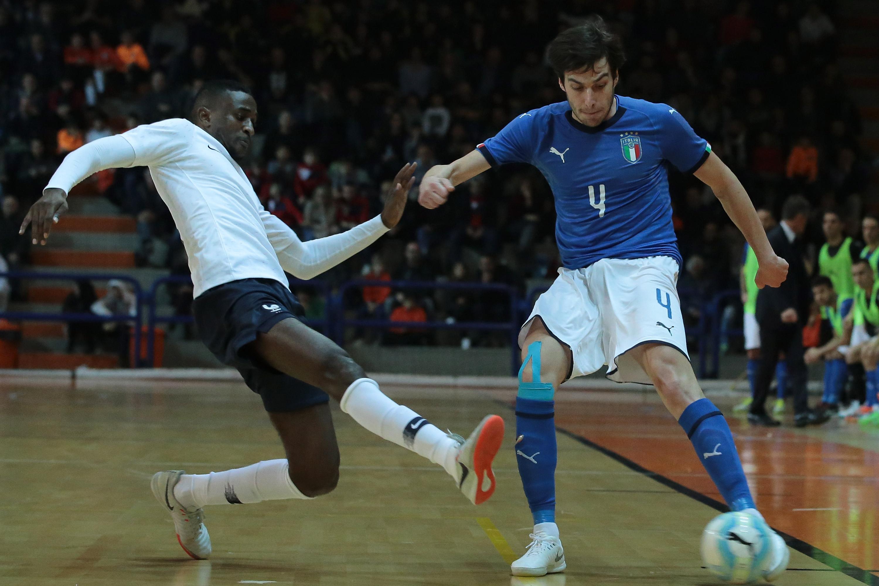 ASTI, ITALY - DECEMBER 04:  Sergio Romano (R) of Italy is challenged by Samba Kebe of France during the Futsal International Friendly match between Italy and France on December 4, 2018 in Asti, Italy.  (Photo by Emilio Andreoli/Getty Images)