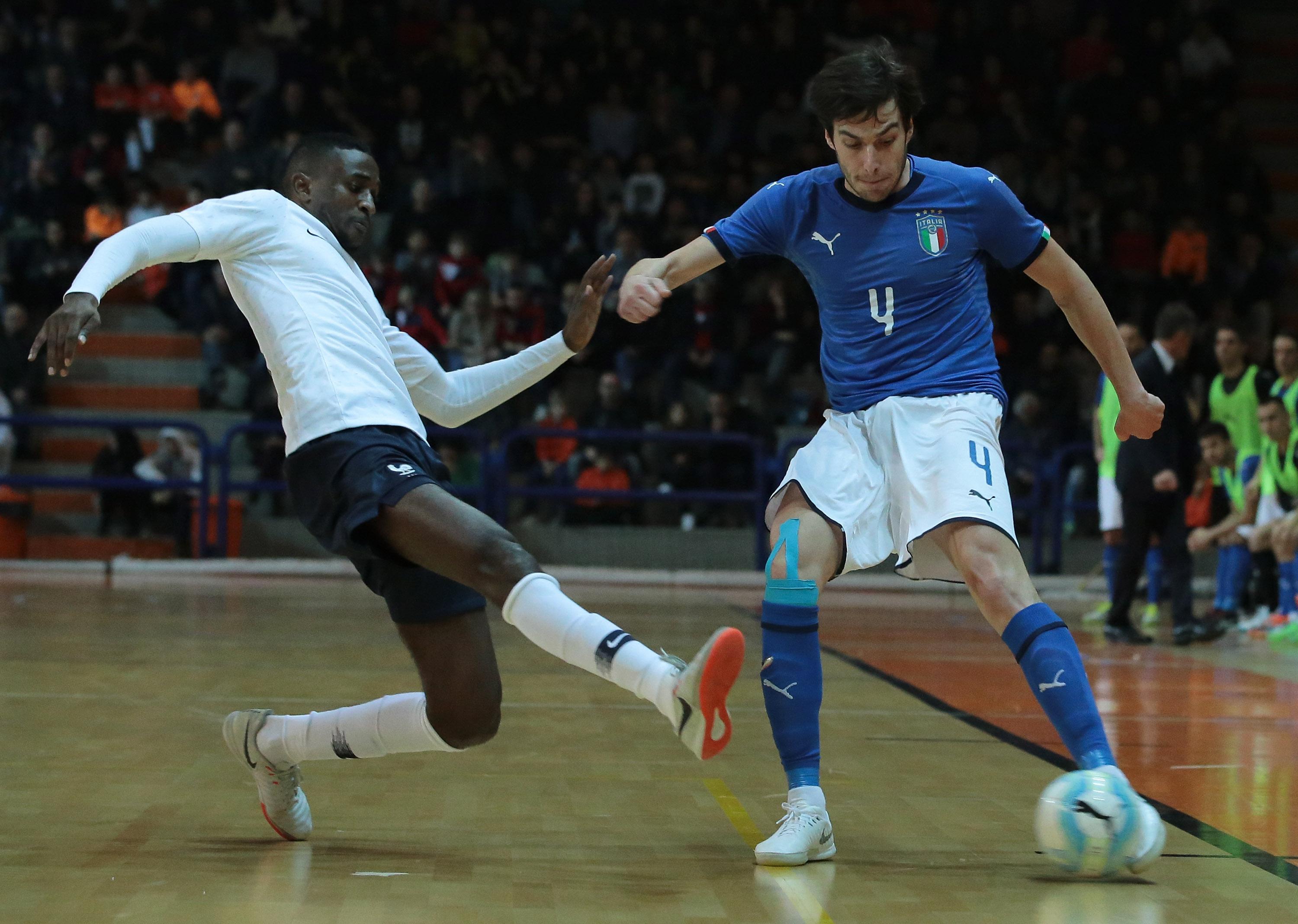 ASTI, ITALY - DECEMBER 04: Sergio Romano (R) of Italy is challenged by Samba Kebe of France during the Futsal International Friendly match between Italy and France on December 4, 2018 in Asti, Italy. (Photo by Emilio Andreoli/Getty Images)