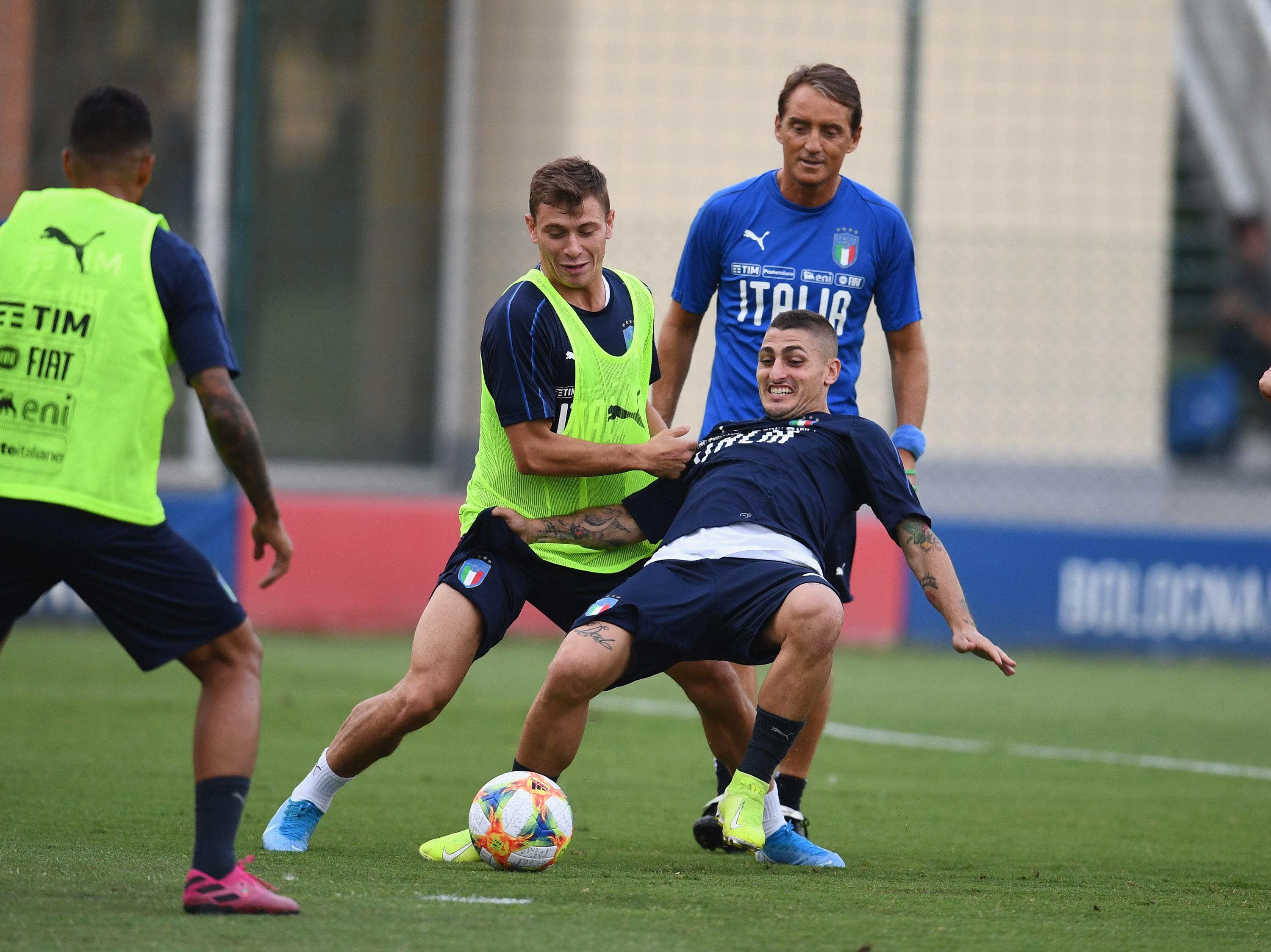 BOLOGNA, ITALY - SEPTEMBER 02: Nicolo Barella and Marco Verratti of Italy compete for the ball during a Italy training session on September 2, 2019 in Bologna, Italy. (Photo by Claudio Villa/Getty Images)