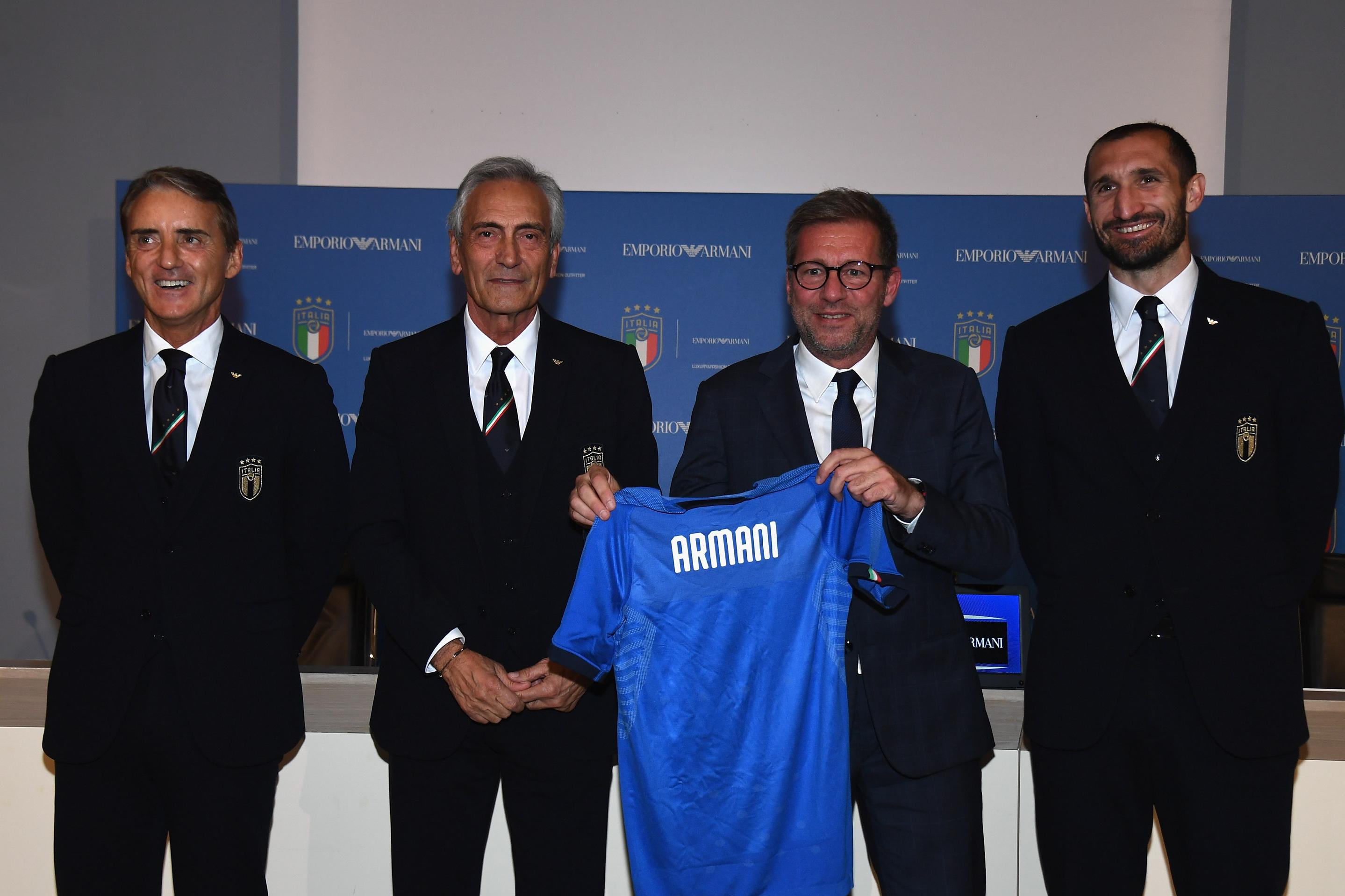 FLORENCE, ITALY - MARCH 18: (L-R) Head coach of Italy Roberto Mancini , FIGC president Gabriele Gravina, Giorgio Armani deputy managing director, commercial Giuseppe Marsocci and Giorgio Chiellini pose during a press conference to unveils new partnership between FIGC and Armani at Centro Tecnico Federale di Coverciano on March 18, 2019 in Florence, Italy. (Photo by Claudio Villa/Getty Images)