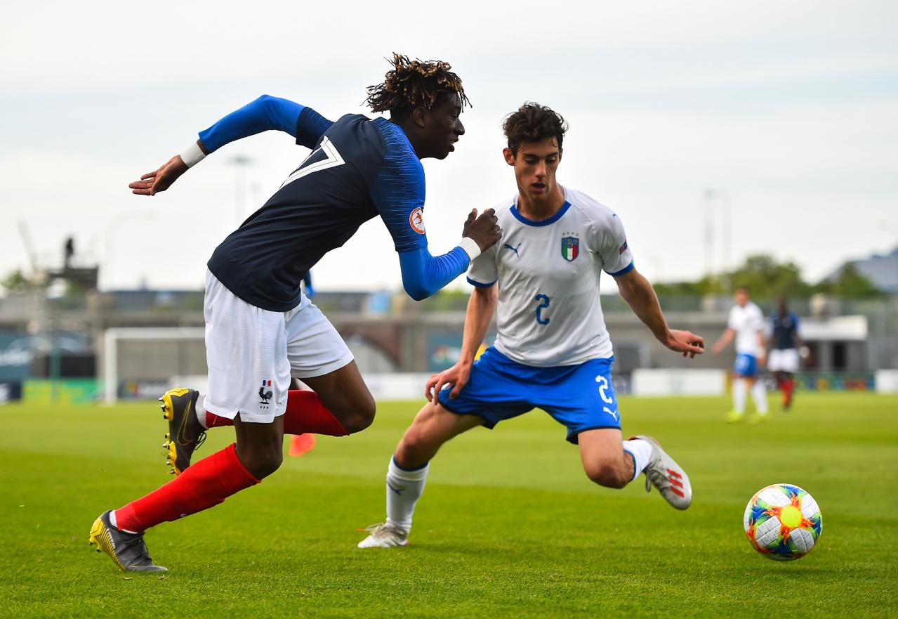 DUBLIN, IRELAND - MAY 16: Kelian Nsona Wa Saka of France and Francesco Lamanna of Italy during the 2019 UEFA European Under-17 Championship semi-final match between France and Italy at Tallaght Stadium, on May 16, 2019, in Tallaght, Dublin, Ireland.