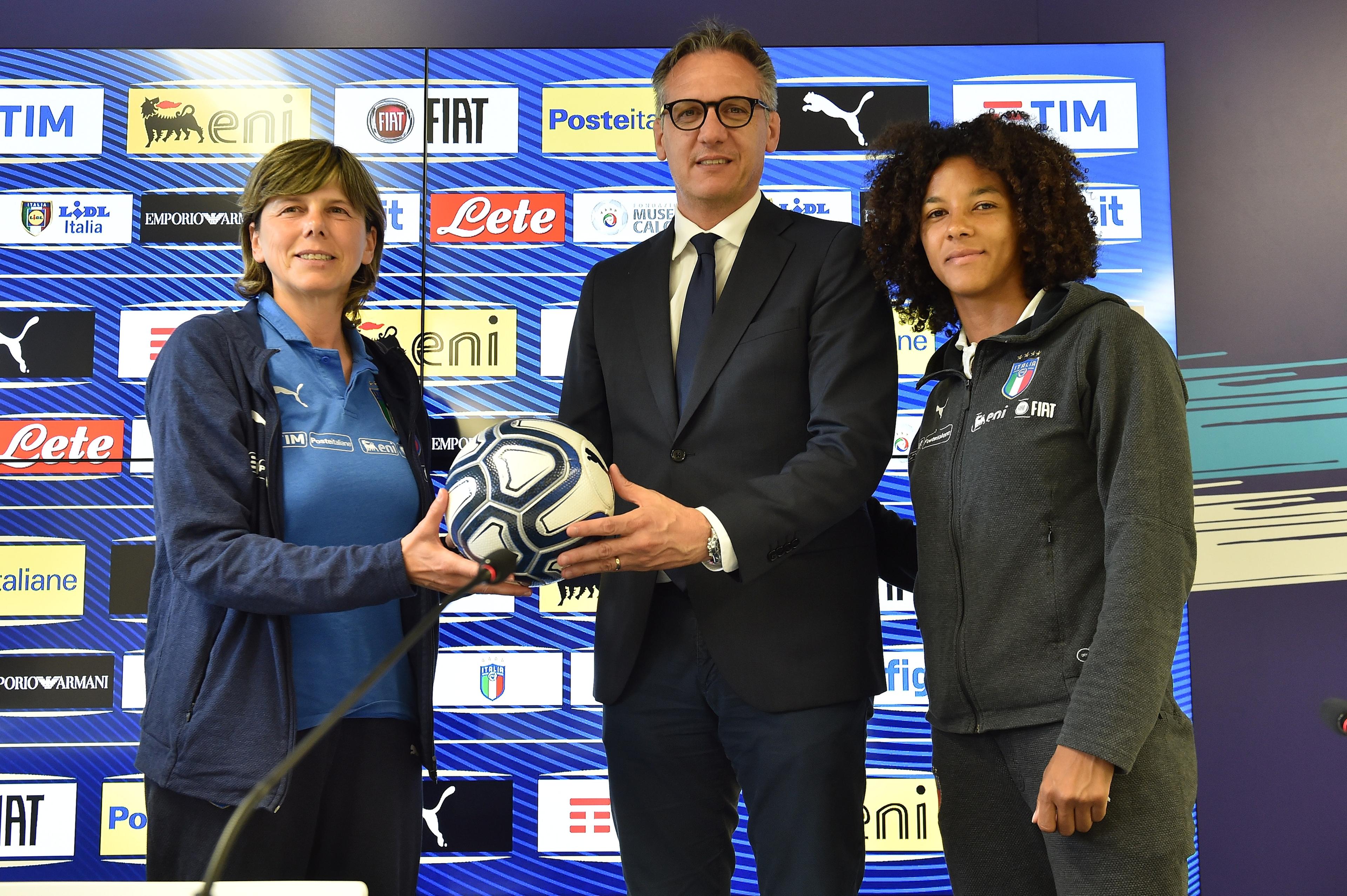 FERRARA, ITALY - MAY 28: Head Coach Milena Bertolini (L) and captain Sara Gama (R) of Italy Women pose with General Manager of SPAL Andrea Gazzoli during a press conference at Paolo Mazza stadium on May 28, 2019 in Ferrara, Italy. (Photo by Tullio M. Puglia/Getty Images)