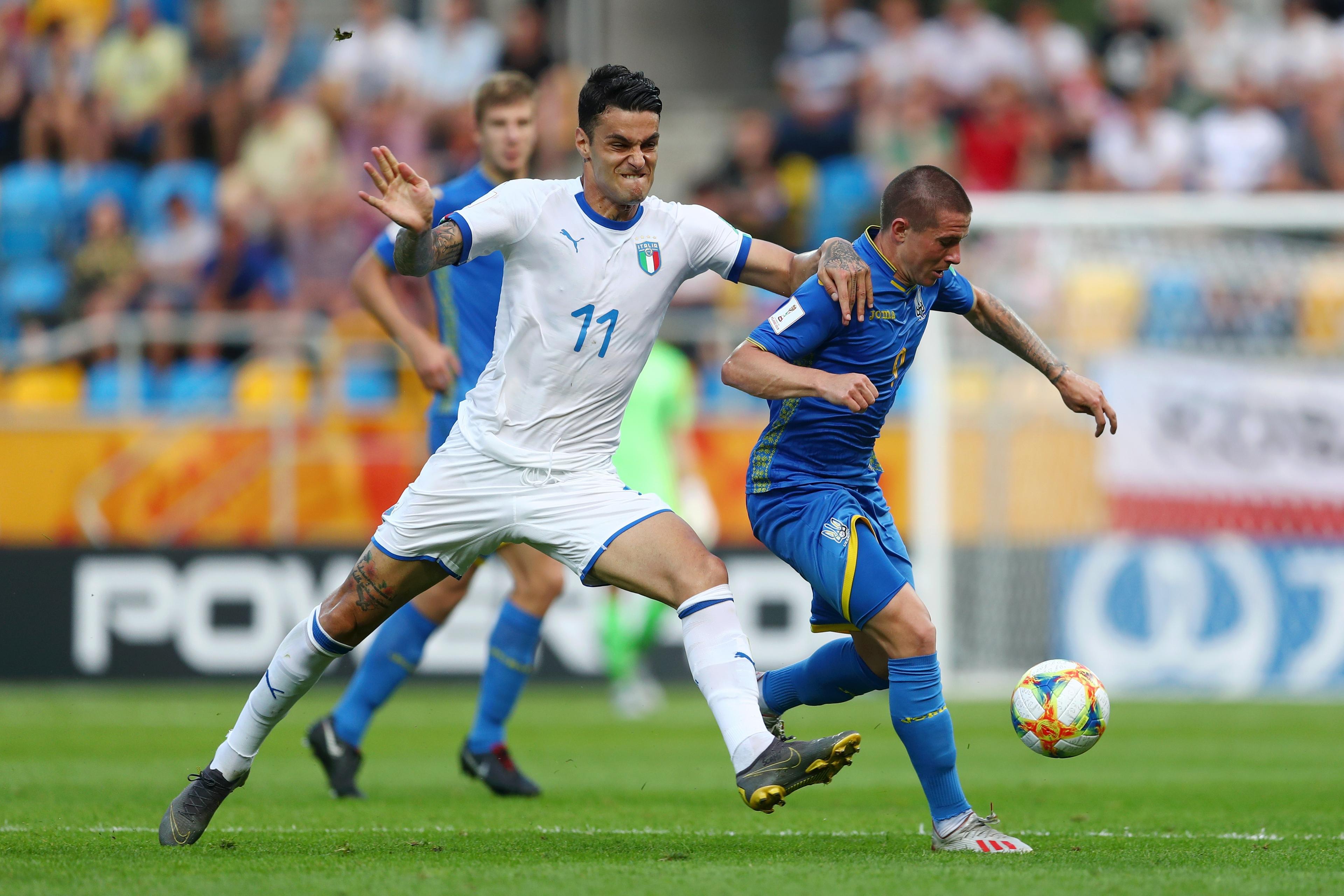 GDYNIA, POLAND - JUNE 11: Viktor Korniienko of Ukraine battles for possession with Gianluca Scamacca of Italy during the 2019 FIFA U-20 World Cup Semi Final match between Ukraine and Italy at Gdynia Stadium on June 11, 2019 in Gdynia, Poland. (Photo by Lars Baron - FIFA/FIFA via Getty Images)