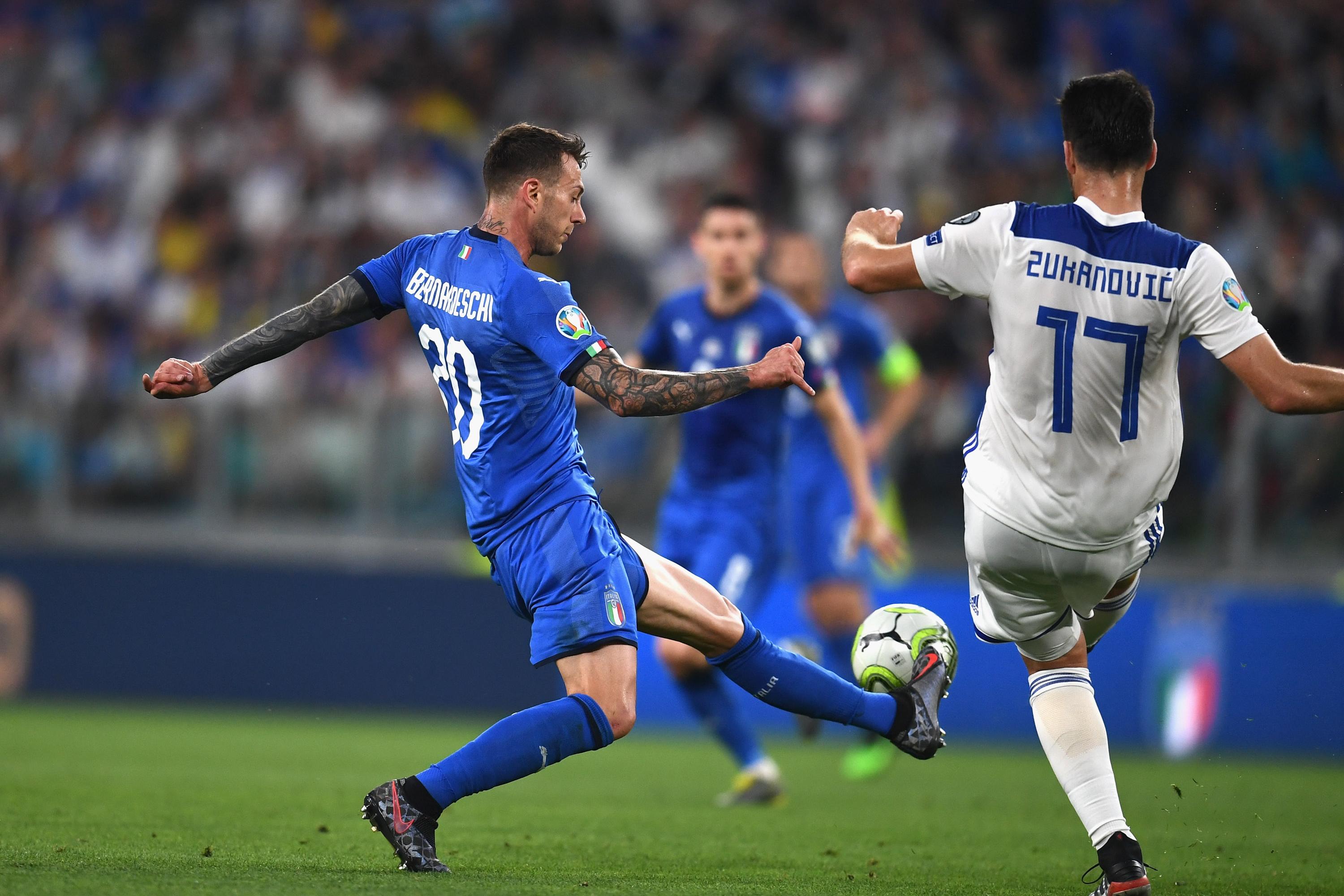 TURIN, ITALY - JUNE 11:  Federico Bernardeschi  of Italy competes for the ball with  Ervin Zukanovic of Bosnia during the UEFA Euro 2020 Qualifier between Italy and Bosnia and Herzegovina at Juventus Stadium on June 11, 2019 in Turin, Italy.  (Photo by Claudio Villa/Getty Images)