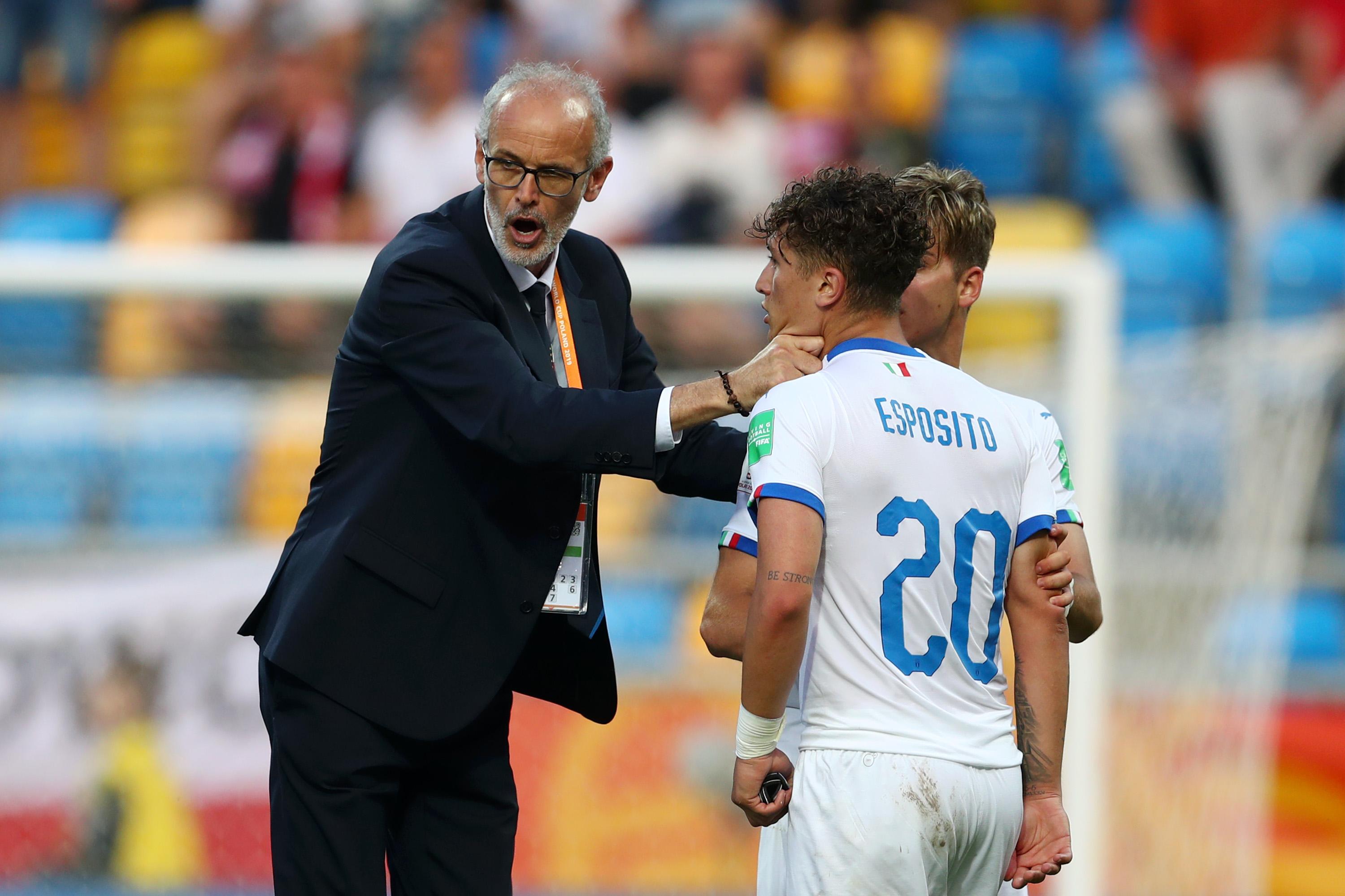 GDYNIA, POLAND - JUNE 11: Paolo Nicolato, head coach of Italy holds his player Salvatore Esposito of Italy back after the 2019 FIFA U-20 World Cup Semi Final match between Ukraine and Italy at Gdynia Stadium on June 11, 2019 in Gdynia, Poland. (Photo by Lars Baron - FIFA/FIFA via Getty Images)