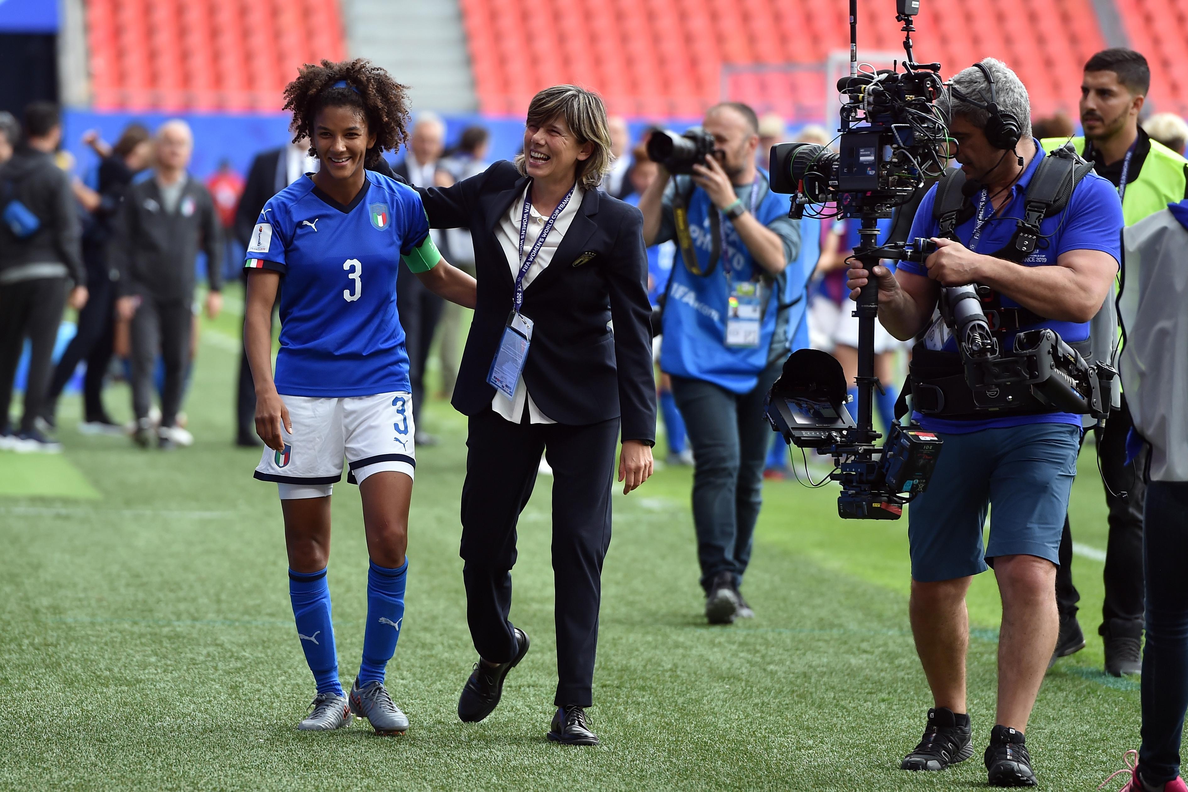 VALENCIENNES, FRANCE - JUNE 09: Sara Gama and  Head Coach Milena Bertolini of Italy celebrate after winning the 2019 FIFA Women\\'s World Cup France group C match between Australia and Italy at Stade du Hainaut on June 09, 2019 in Valenciennes, France. (Photo by Tullio M. Puglia/Getty Images)