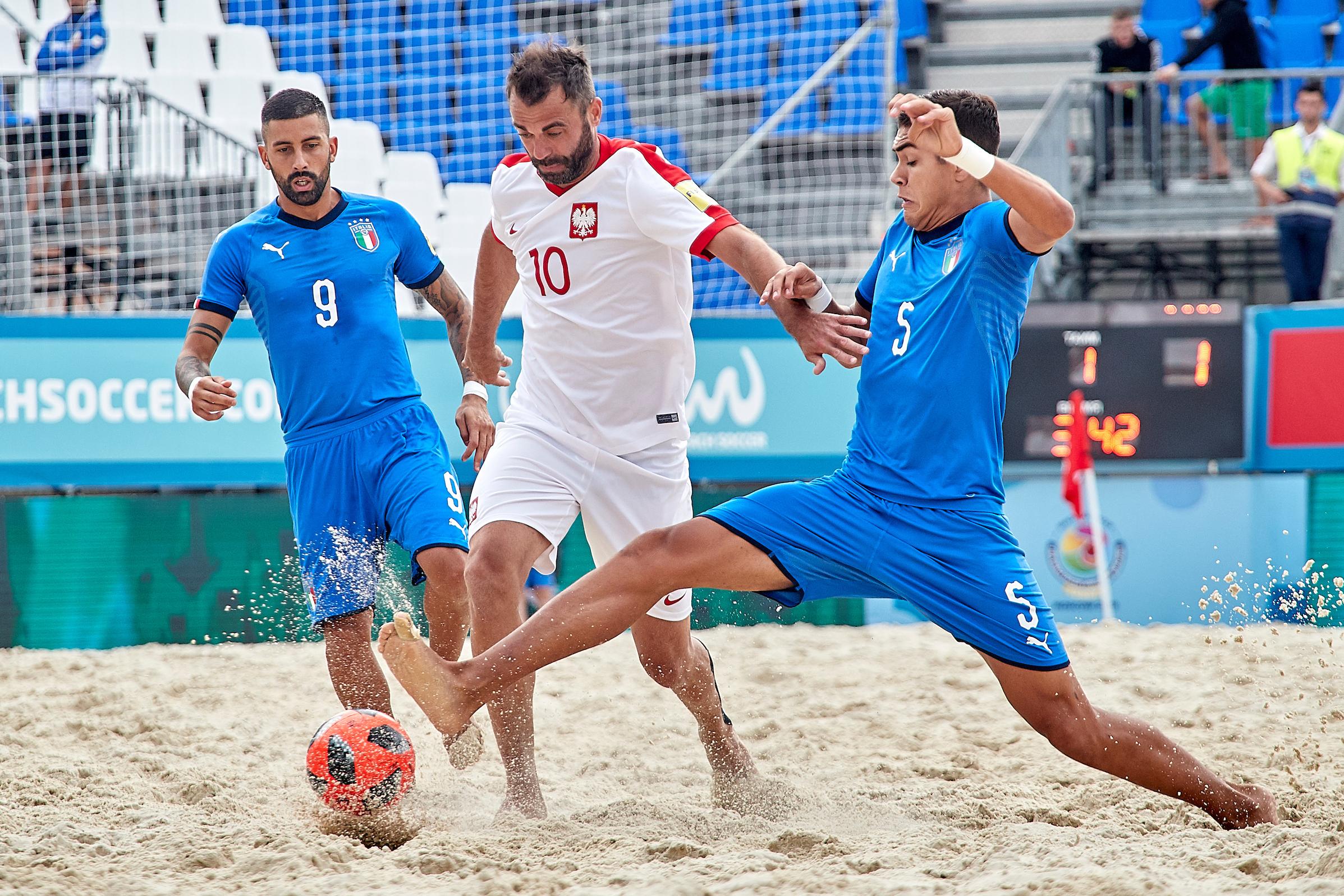 MOSCOW, RUSSIA - JULY 24: Josep Jr Gentilin of Italy competes for the ball with Daniel Baran of Poland during the FIFA Beach Soccer World Cup Qualifier Europe 2019 at Luzhniki Park on July 24, 2019 in Moscow, Russia. (Photo by Jose M. Alvarez)