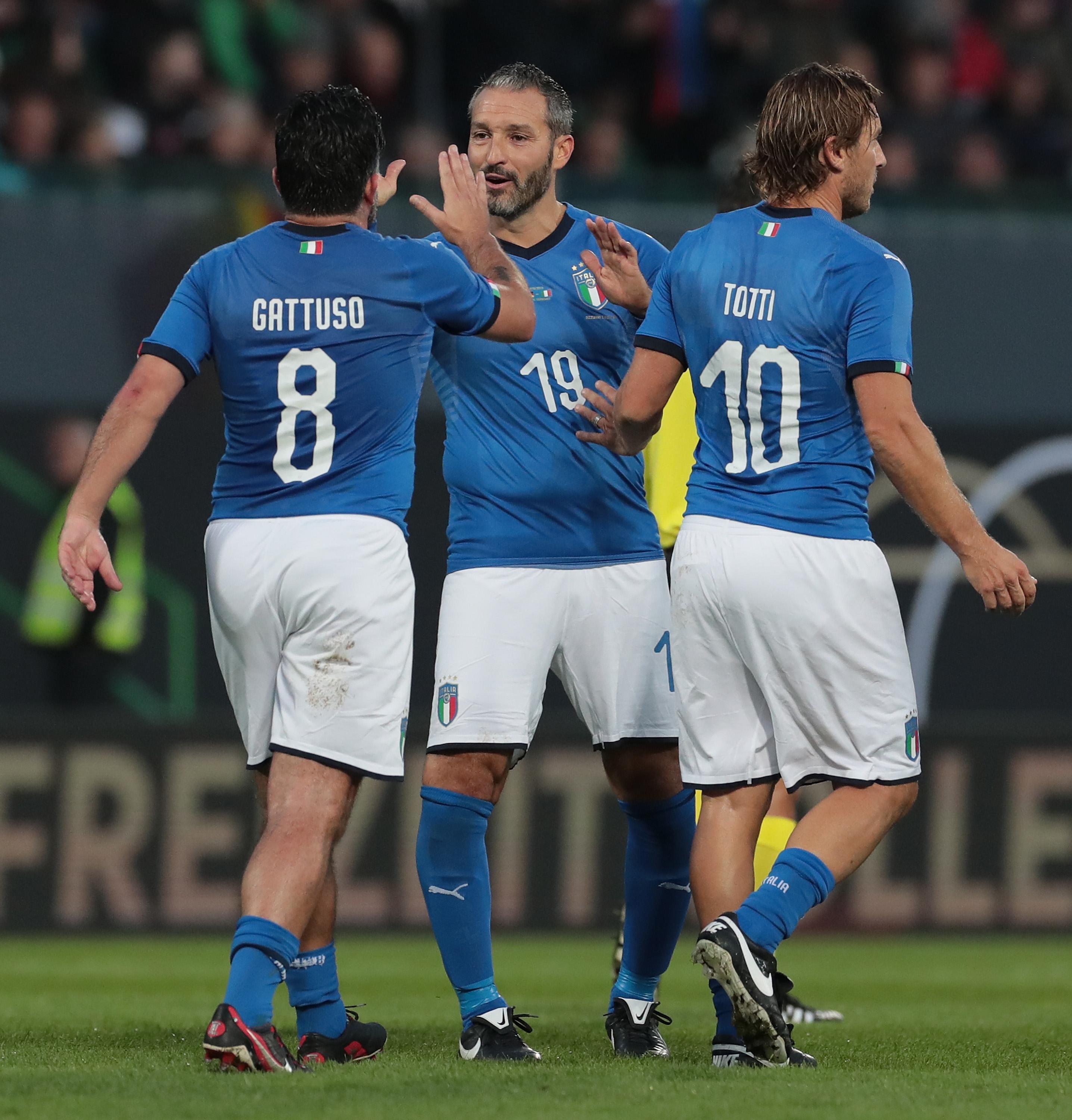 FUERTH, GERMANY - OCTOBER 07: Francesco Totti of Azzurri Legends celebrates his goal with his team-mates Gianluca Zambrotta and Ivan Gennaro Gattuso during the friendly match between DFB-All-Stars and Azzurri Legends at Sportpark Ronhof Thomas Sommer on October 7, 2019 in Fuerth, Germany. (Photo by Emilio Andreoli/Getty Images)
