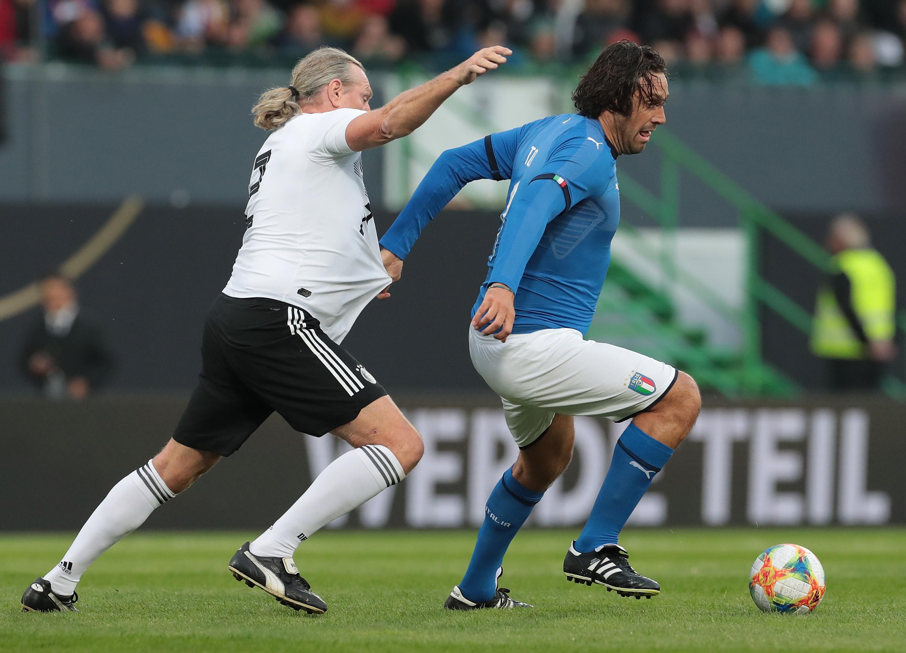 FUERTH, GERMANY - OCTOBER 07: Luca Toni of Azzurri Legends is challenged by Michael Schulz of DFB-All-Stars during the friendly match between DFB-All-Stars and Azzurri Legends at Sportpark Ronhof Thomas Sommer on October 7, 2019 in Fuerth, Germany. (Photo by Emilio Andreoli/Getty Images)