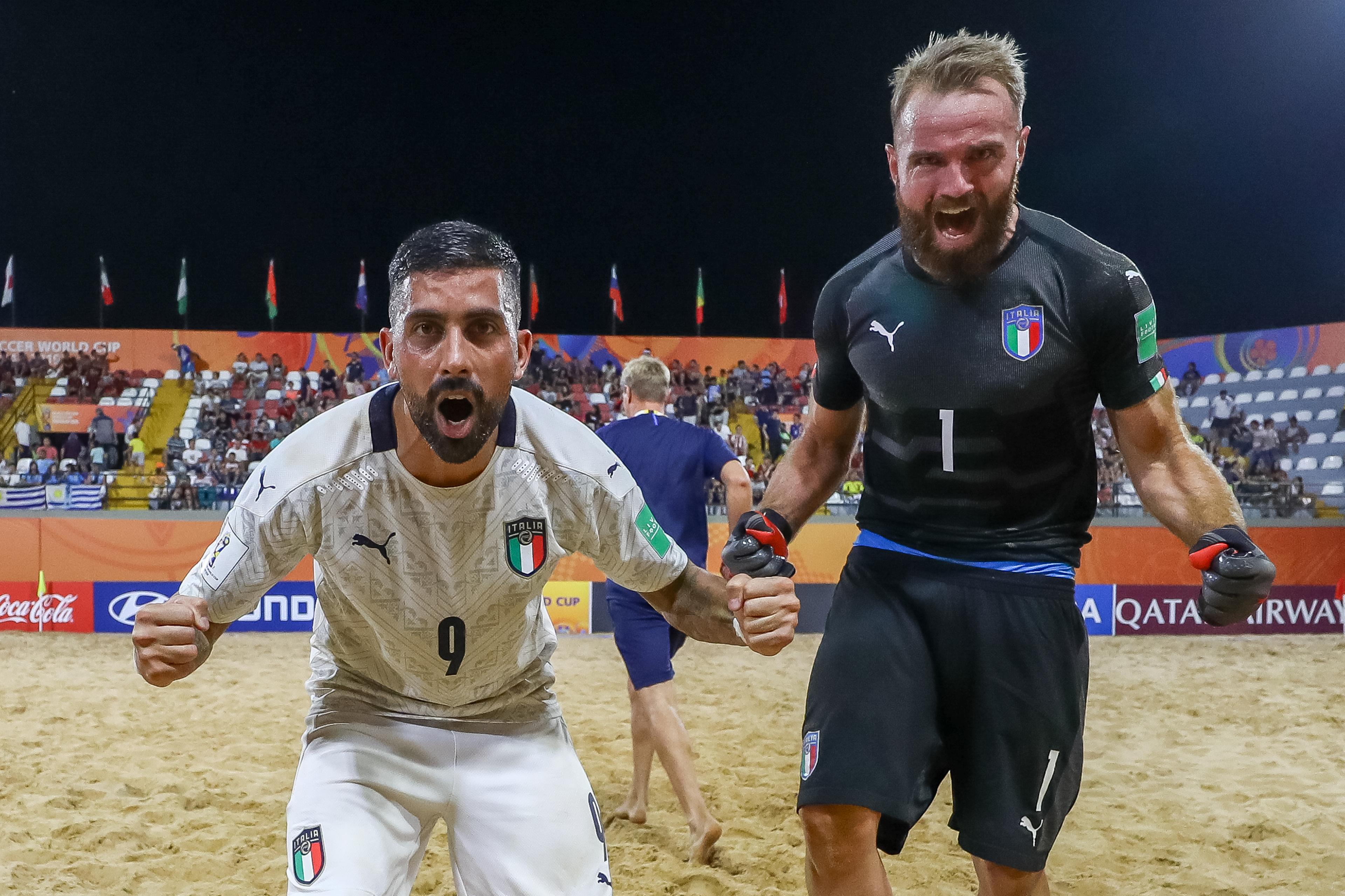 ASUNCION, PARAGUAY - NOVEMBER 28: Emmanuele Zurlo and goalkeeper Simone Del Mestre of Italy celebrate the victory after the FIFA Beach Soccer World Cup Paraguay 2019 quarter final match between Italy and Switzerland at Estadio Mundialista Los Pynandi on November 28, 2019 in Asuncion, Paraguay. (Photo by Buda Mendes - FIFA/FIFA via Getty Images)