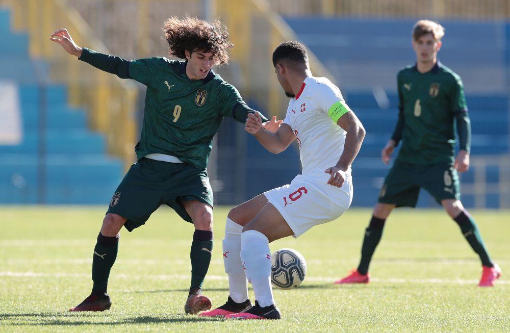 LECCO, ITALY - FEBRUARY 12: Alessandro Cortinovis of Italy competes for the ball with Simon Sohm of Switzerland during the International Friendly match between Italy U19 and Switzerland U19 on February 12, 2020 in Lecco, Italy. (Photo by Emilio Andreoli/Getty Images)