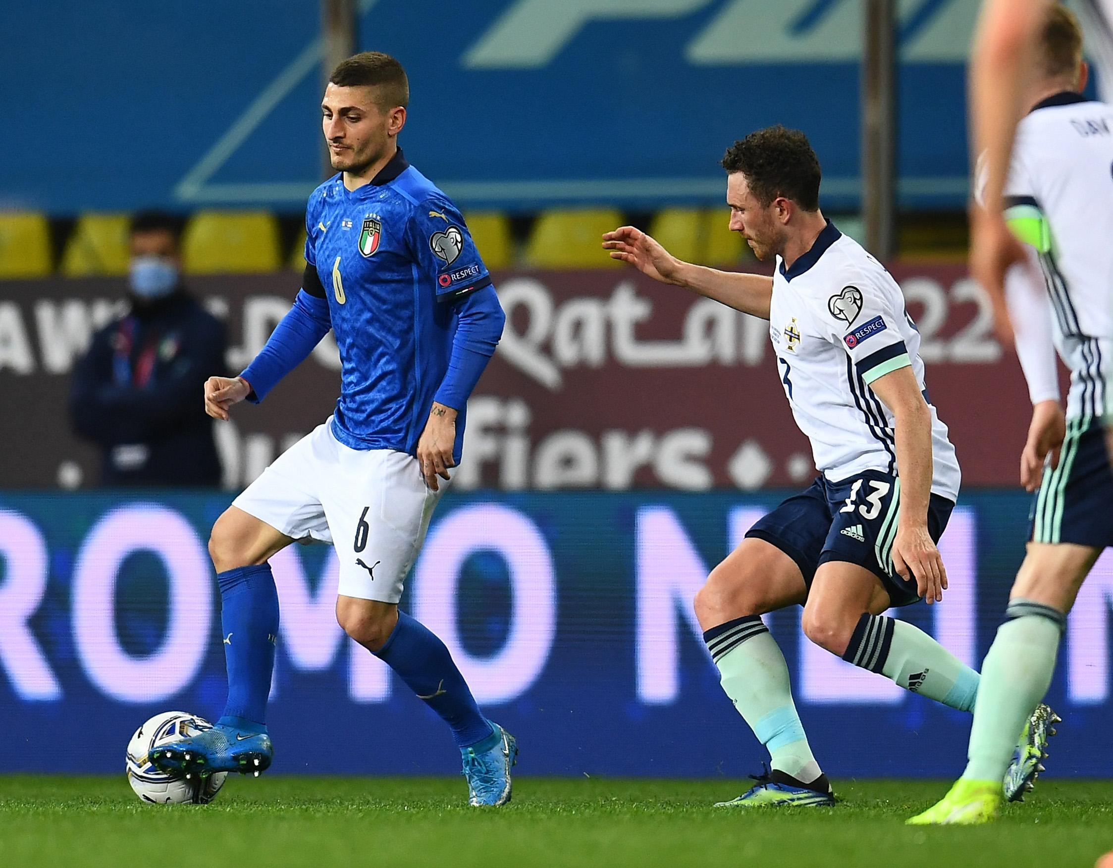 PARMA, ITALY - MARCH 25: Marco Verratti of Italy competes for the ball with Corry Evans of Northern Ireland during the FIFA World Cup 2022 Qatar qualifying match between Italy and Northern Ireland on March 25, 2021 in Parma, Italy. Sporting stadiums around Italy remain under strict restrictions due to the Coronavirus Pandemic as Government social distancing laws prohibit fans inside venues resulting in games being played behind closed doors. (Photo by Claudio Villa/Getty Images)