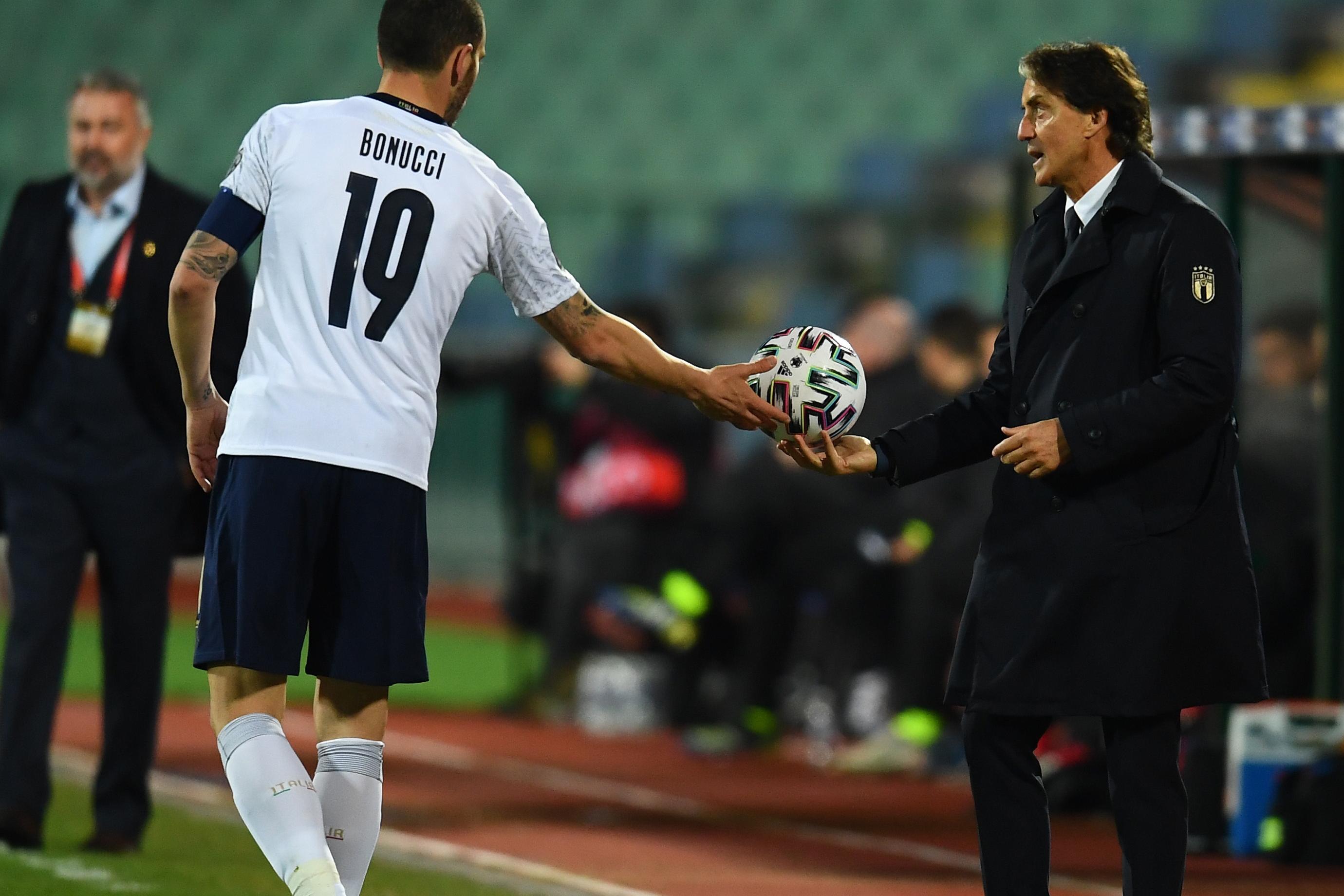 SOFIA, BULGARIA - MARCH 28:  Head coach of Itlay Roberto Mancini shoots a ball to his player Leonardo Bonucci of Italy during the FIFA World Cup 2022 Qatar qualifying match between Bulgaria and Italy on March 28, 2021 in Sofia, Bulgaria. (Photo by Claudio Villa/Getty Images)