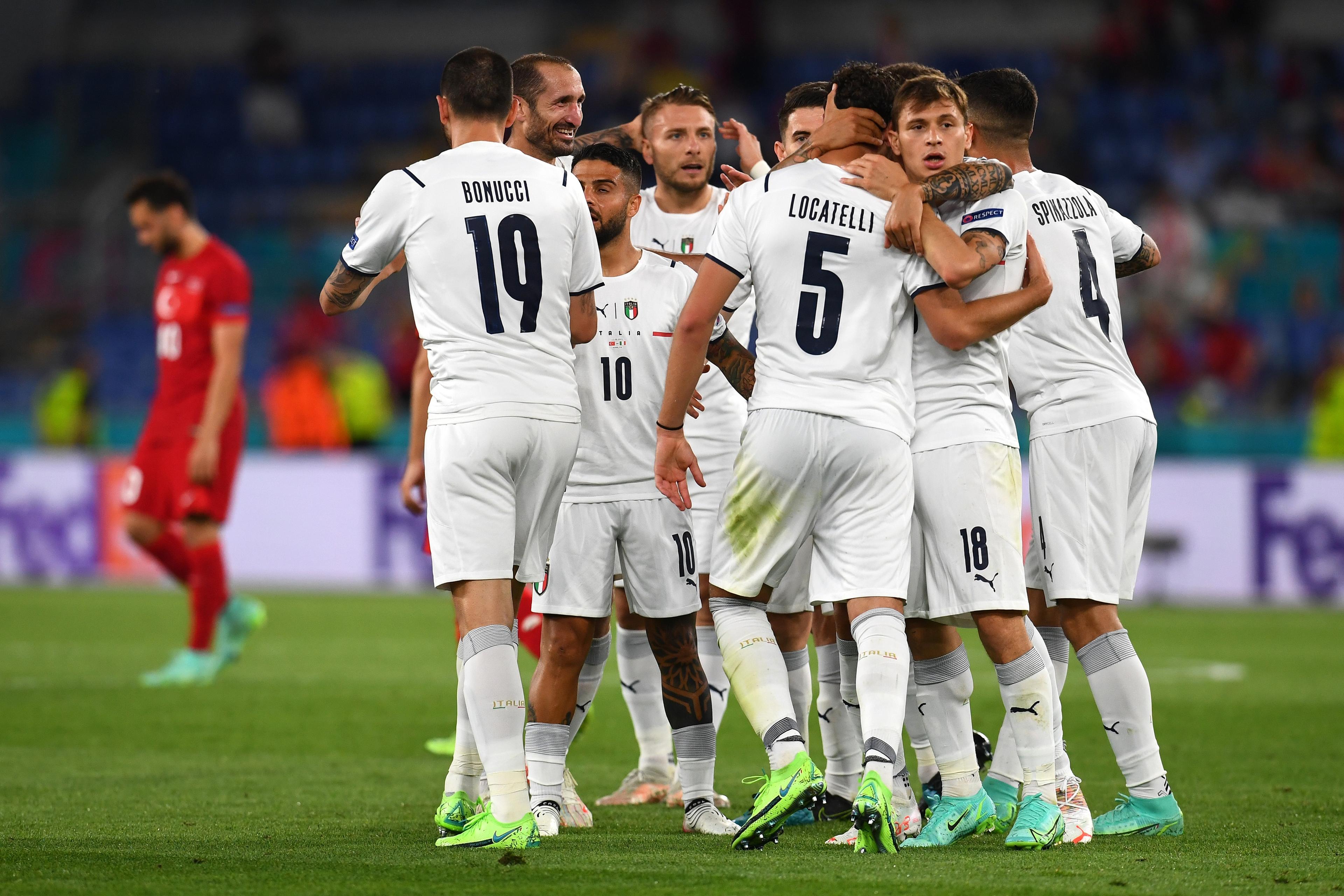 ROME, ITALY - JUNE 11: Players of Italy celebrate their side\\'s first goal, an own goal by Merih Demiral of Turkey (not pictured) during the UEFA Euro 2020 Championship Group A match between Turkey and Italy at the Stadio Olimpico on June 11, 2021 in Rome, Italy. (Photo by Claudio Villa/Getty Images)