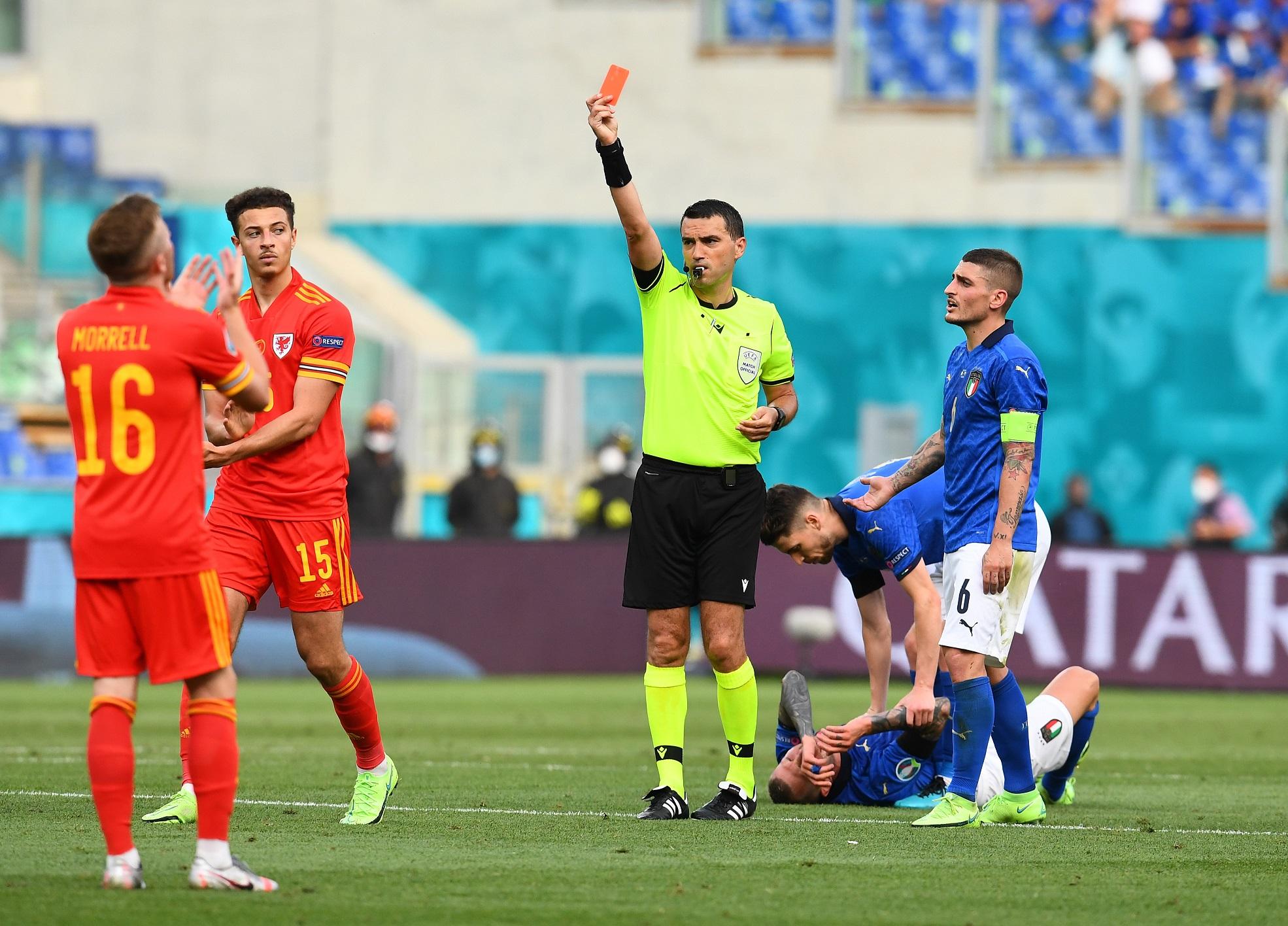 ROME, ITALY - JUNE 20: Ethan Ampadu of Wales reacts as he is shown a red card by Match Referee, Ovidiu Hategan during the UEFA Euro 2020 Championship Group A match between Italy and Wales at Olimpico Stadium on June 20, 2021 in Rome, Italy. (Photo by Claudio Villa/Getty Images)