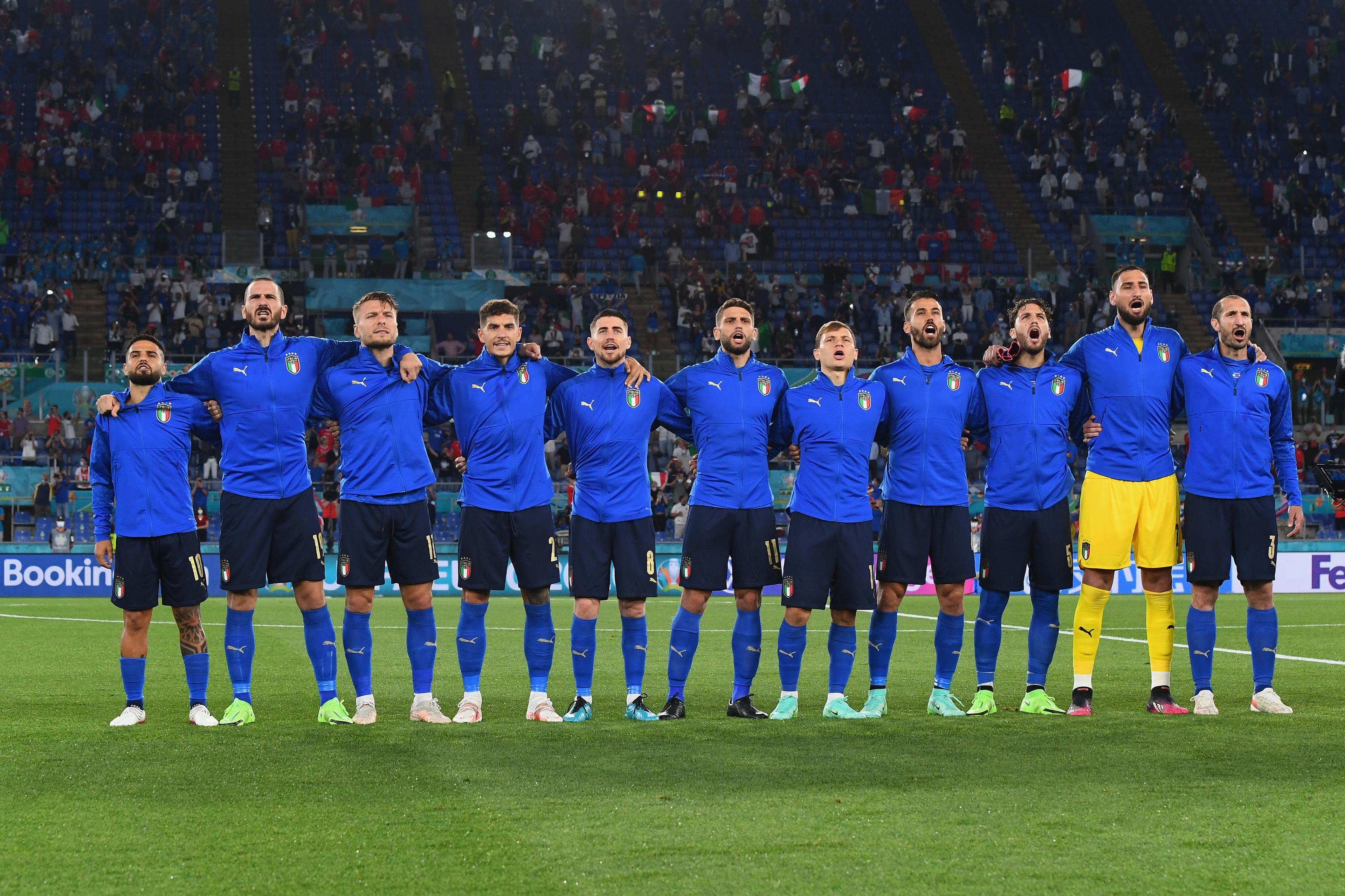 ROME, ITALY - JUNE 16: Players of a Italy stand to sing the national anthem prior to the UEFA Euro 2020 Championship Group A match between Italy and Switzerland at Olimpico Stadium on June 16, 2021 in Rome, Italy. (Photo by Claudio Villa/Getty Images)