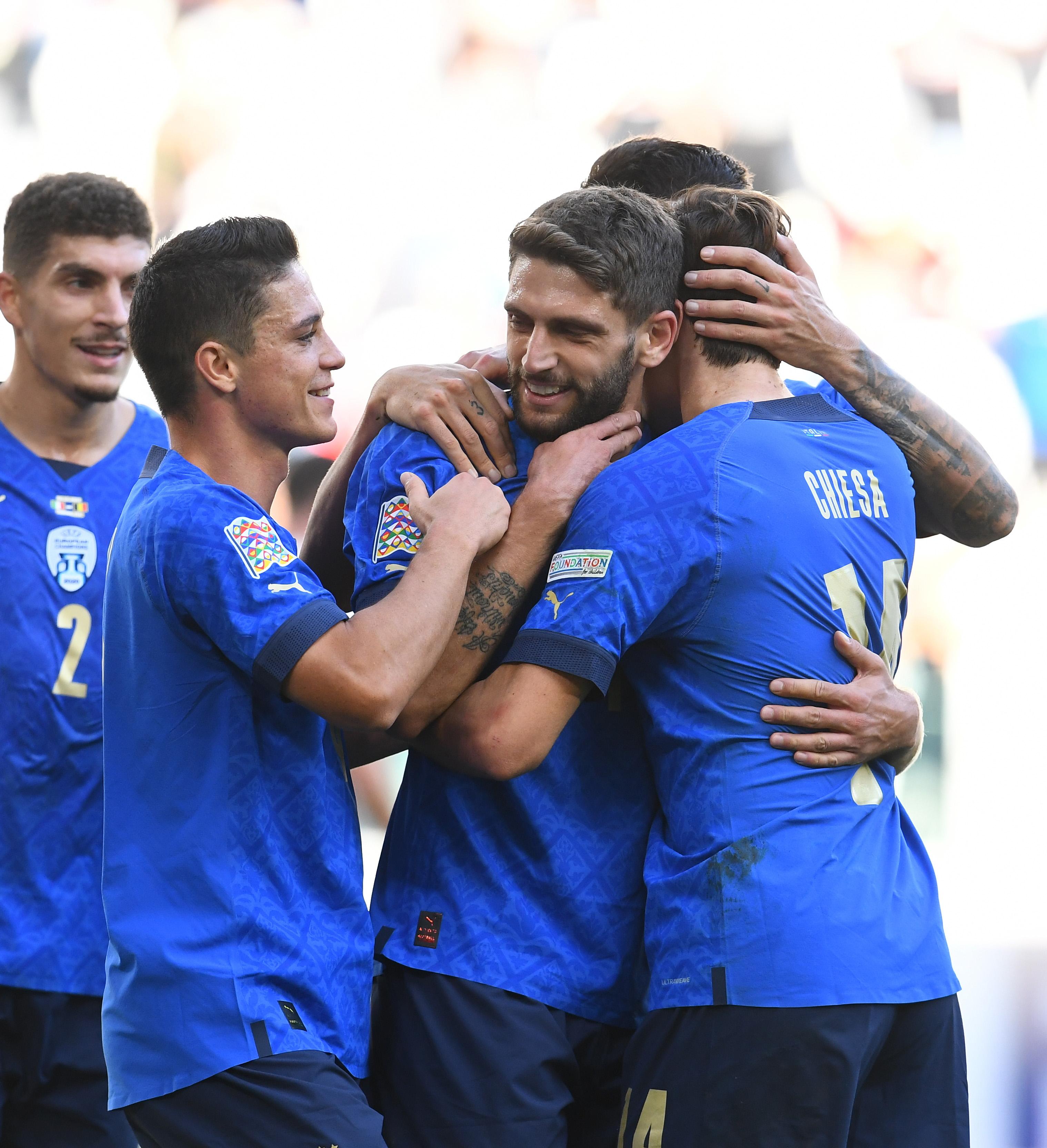 TURIN, ITALY - OCTOBER 10: Domenico Berardi of Italy celebrates with team-mates after scoring the second goal during the UEFA Nations League 2021 Third Place Match between Italy and Belgium at Juventus Stadium on October 10, 2021 in Turin, Italy. (Photo by Claudio Villa/Getty Images)