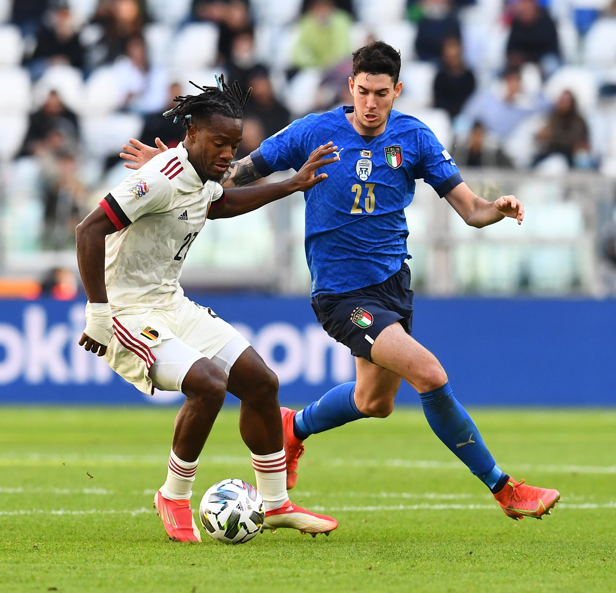 TURIN, ITALY - OCTOBER 10: Alessandro Bastoni of Italy competes for the ball with Michy Batshuayi of Belgium during the UEFA Nations League 2021 Third Place Match between Italy and Belgium at Juventus Stadium on October 10, 2021 in Turin, Italy. (Photo by Claudio Villa/Getty Images)