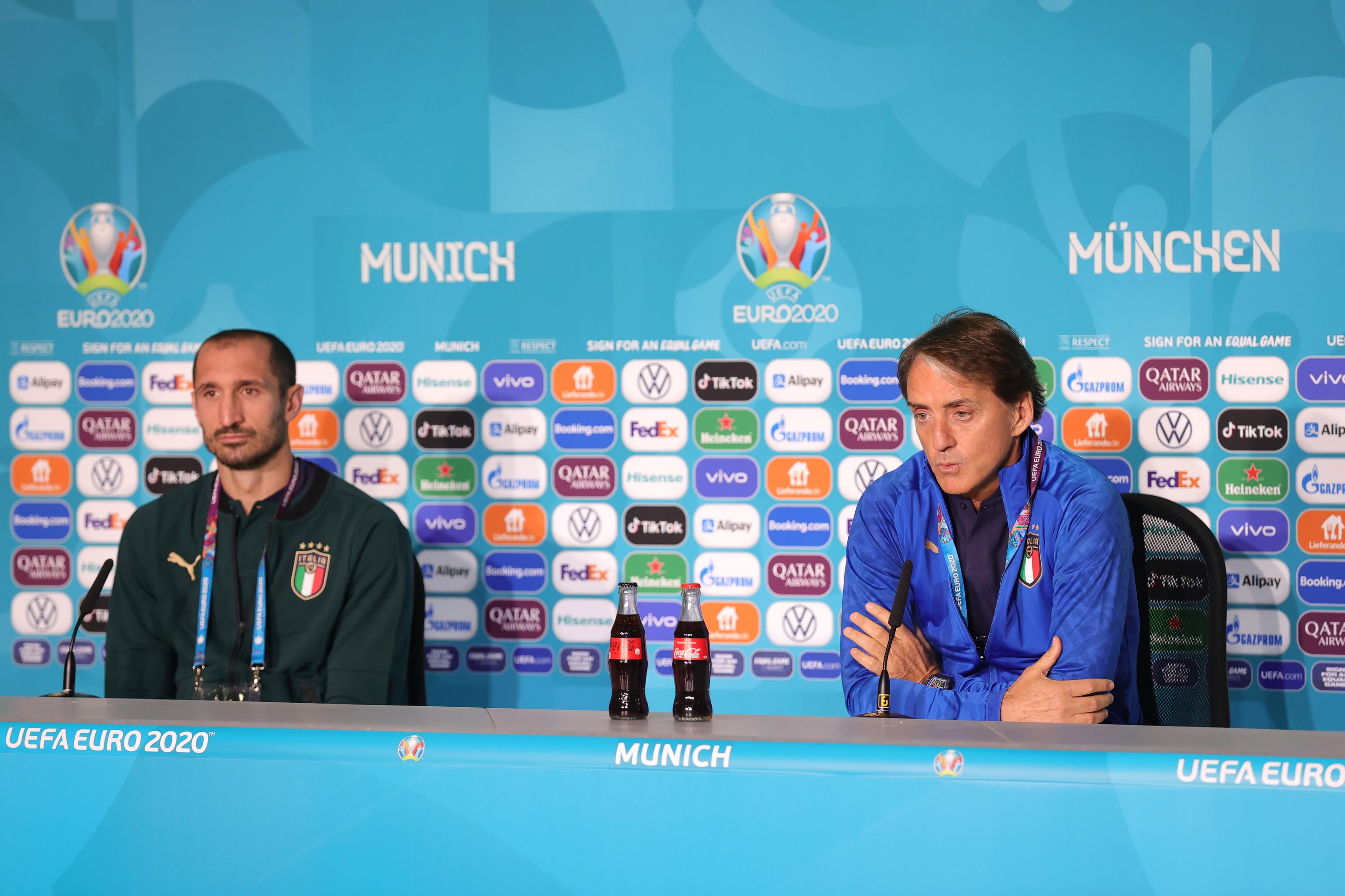 MUNICH, GERMANY - JULY 01: In this handout picture provided by UEFA, Giorgio Chiellini of Italy and Roberto Mancini, Head Coach of Italy speak to the media during the Italy Press Conference ahead of the Euro 2020 Quarter Final match between Italy and Belgium at Fussball Arena Muenchen on July 01, 2021 in Munich, Germany. (Photo by UEFA/UEFA via Getty Images)