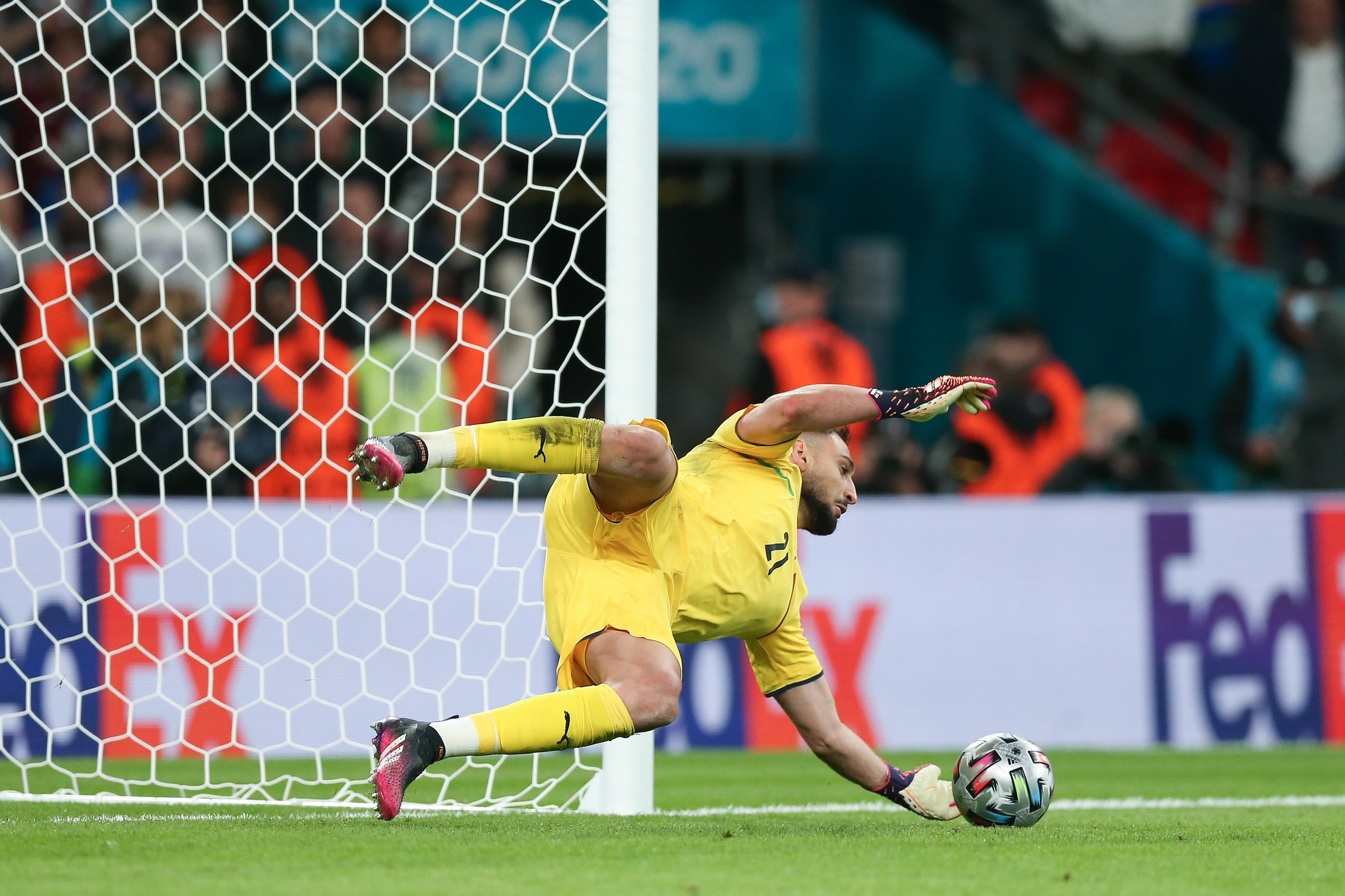 LONDON, ENGLAND - JULY 06: Gianluigi Donnarumma of Italy saves a penalty from Alvaro Morata of Spain in the shoot out during the UEFA Euro 2020 Championship Semi-final match between Italy and Spain at Wembley Stadium on July 06, 2021 in London, England. (Photo by Alex Morton - UEFA/UEFA via Getty Images)