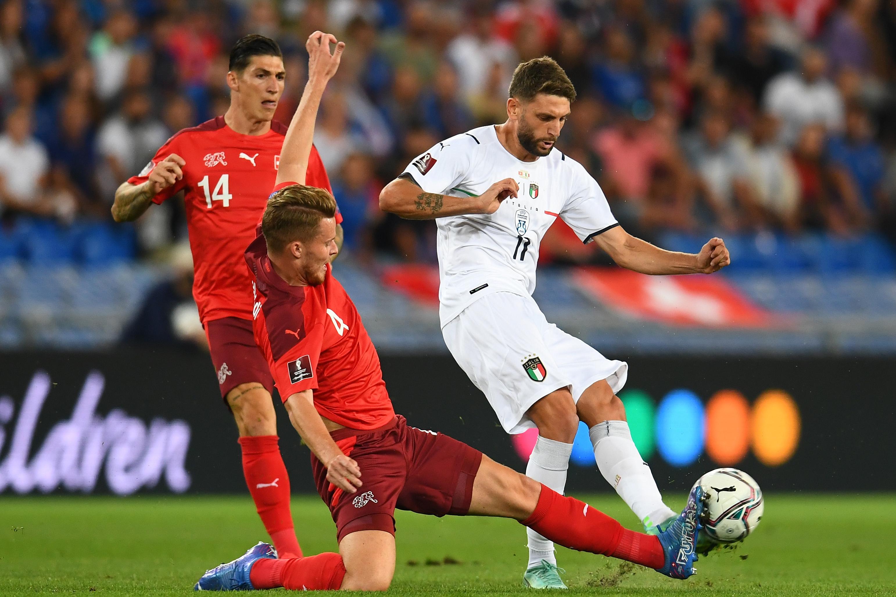 BASEL, SWITZERLAND - SEPTEMBER 05:  Domenico Berardi of Italy competes for the ball with Nico Elvedi of Switzerland during the 2022 FIFA World Cup Qualifier match between Switzerland and Italy at St Jacob Park on September 05, 2021 in Basel, Basel-Stadt. (Photo by Claudio Villa/Getty Images)