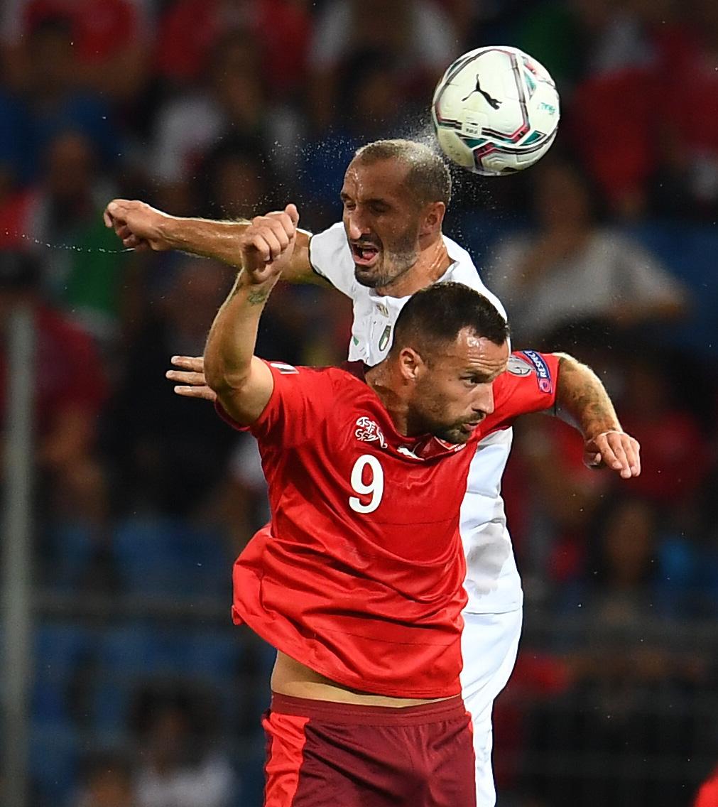 BASEL, SWITZERLAND - SEPTEMBER 05: Giorgio Chielliniof Italy competes for the ball with Haris Seferovic of Switzerland during the 2022 FIFA World Cup Qualifier match between Switzerland and Italy at St Jacob Park on September 05, 2021 in Basel, Basel-Stadt. (Photo by Claudio Villa/Getty Images)
