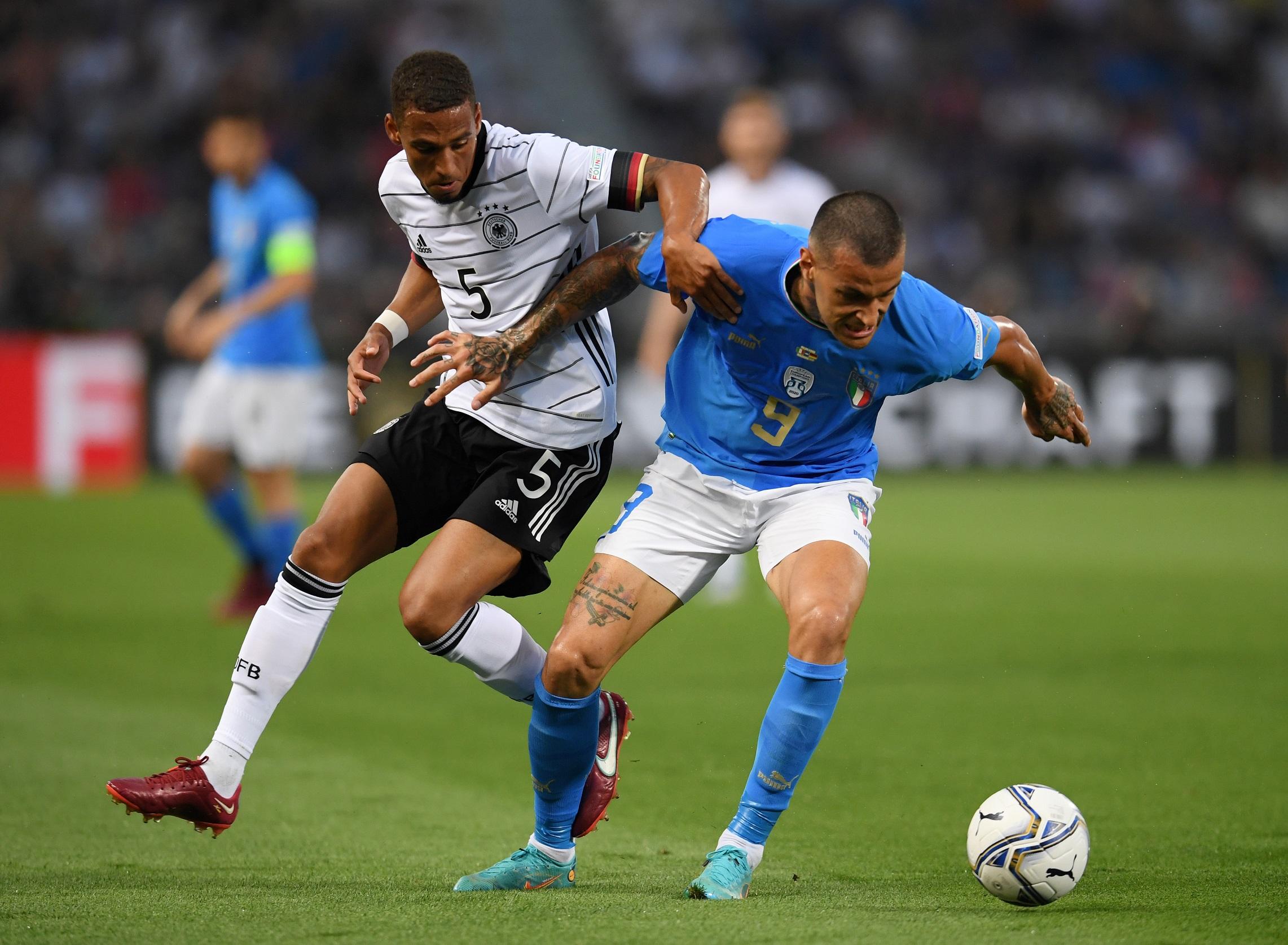 BOLOGNA, ITALY - JUNE 04: Gianluca Scamacca of Italy battles for possession with Thilo Kehrer of Germany during the UEFA Nations League League A Group 3 match between Italy and Germany at Renato Dall'Ara Stadium on June 04, 2022 in Bologna, Italy. (Photo by Claudio Villa/Getty Images)