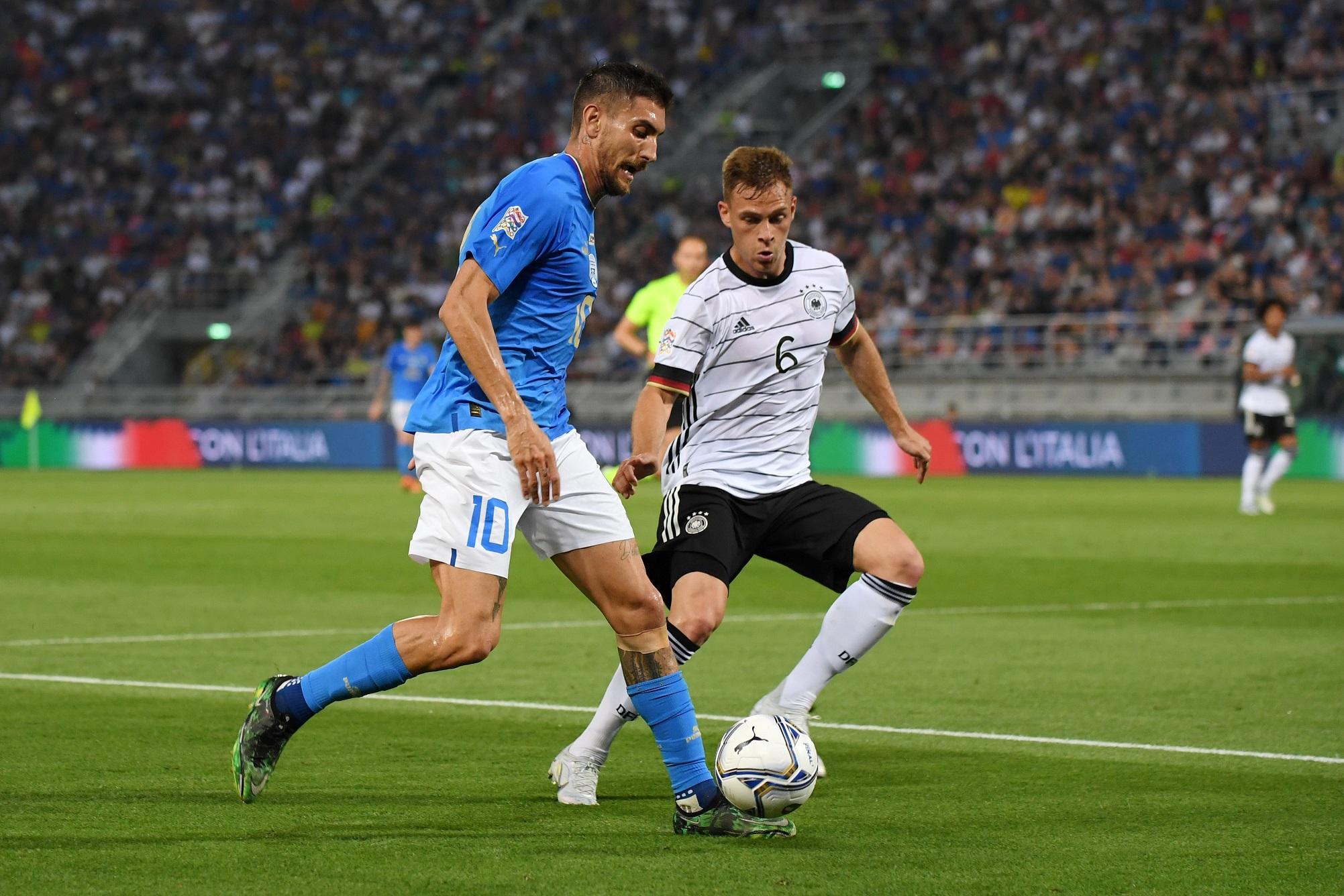 BOLOGNA, ITALY - JUNE 04: Lorenzo Pellegrini of Italy battles for possession with Joshua Kimmich of Germany during the UEFA Nations League League A Group 3 match between Italy and Germany at Renato Dall'Ara Stadium on June 04, 2022 in Bologna, Italy. (Photo by Claudio Villa/Getty Images)