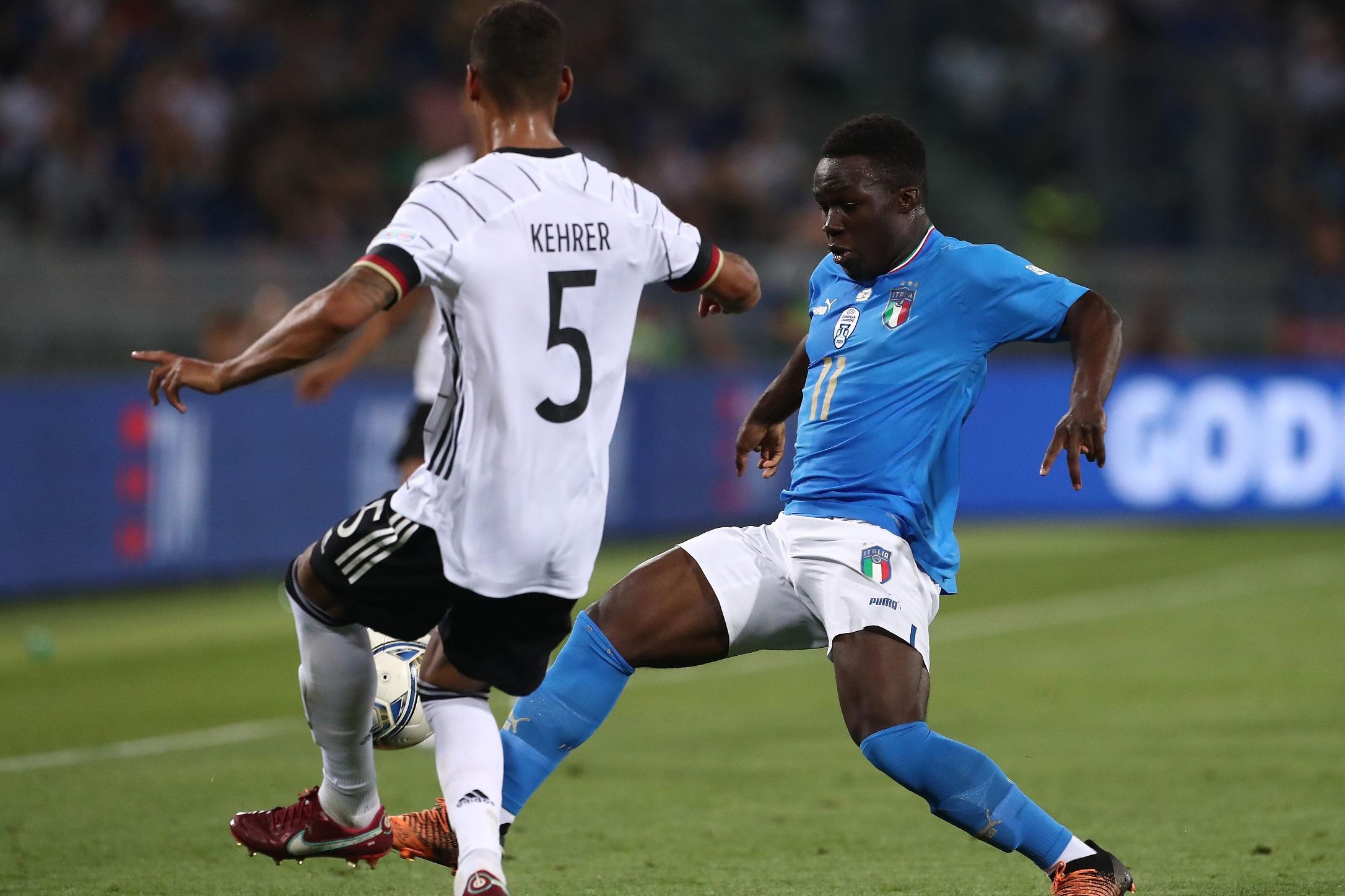 BOLOGNA, ITALY - JUNE 04: David Wilfred Gnonto (R) of Italy is challenged by Thilo Kehrer (L of Germany during the UEFA Nations League League A Group 3 match between Italy and Germany at Renato Dall\\'Ara Stadium on June 04, 2022 in Bologna, Italy. (Photo by Marco Luzzani/Getty Images)