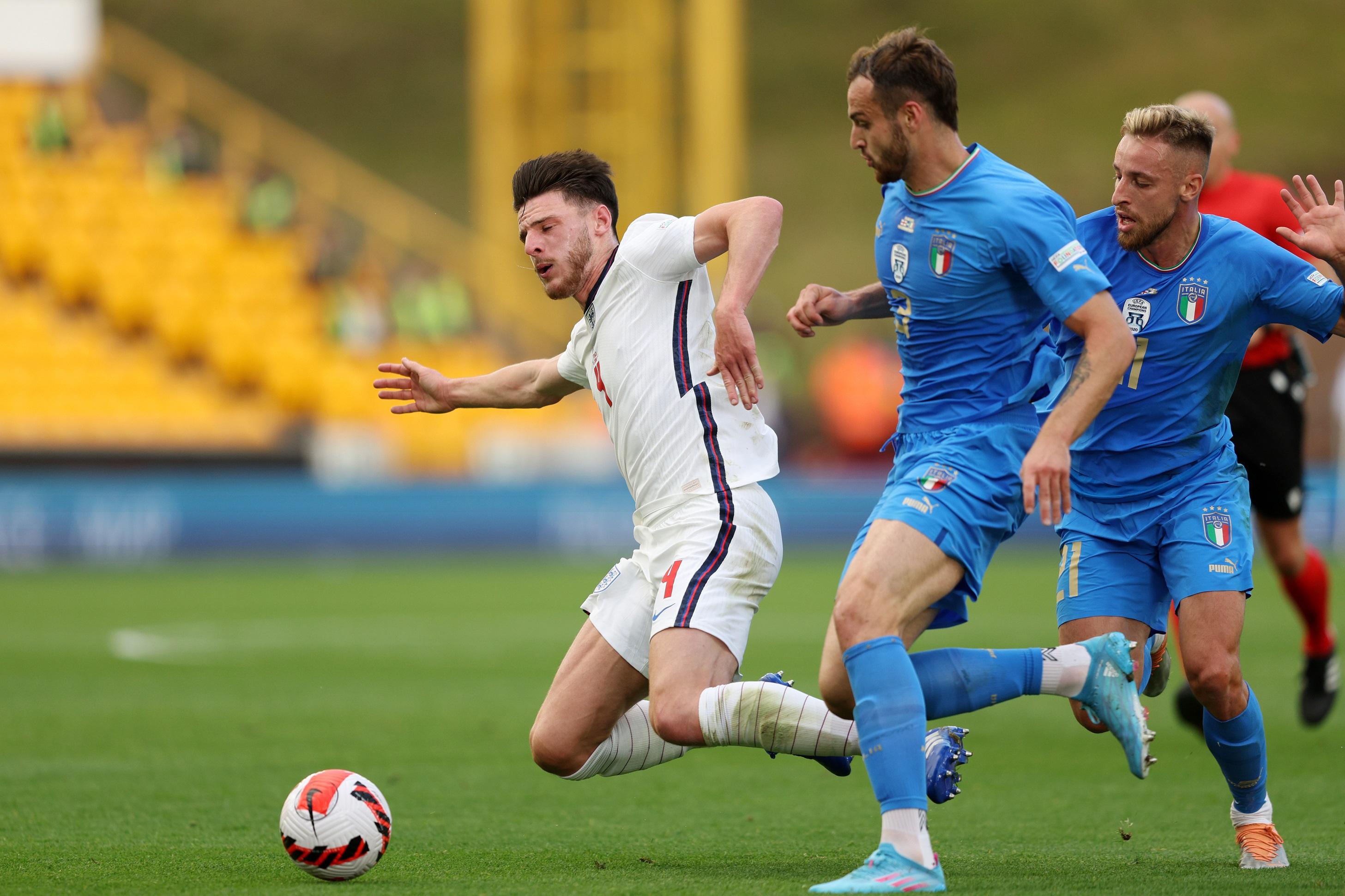 WOLVERHAMPTON, ENGLAND - JUNE 11: Declan Rice of England is challenged by Federico Gatti of Italy during the UEFA Nations League - League A Group 3 match between England and Italy at Molineux on June 11, 2022 in Wolverhampton, England. This game will be played behind closed doors following on from the Euro 2020 final (Photo by Richard Heathcote/Getty Images)