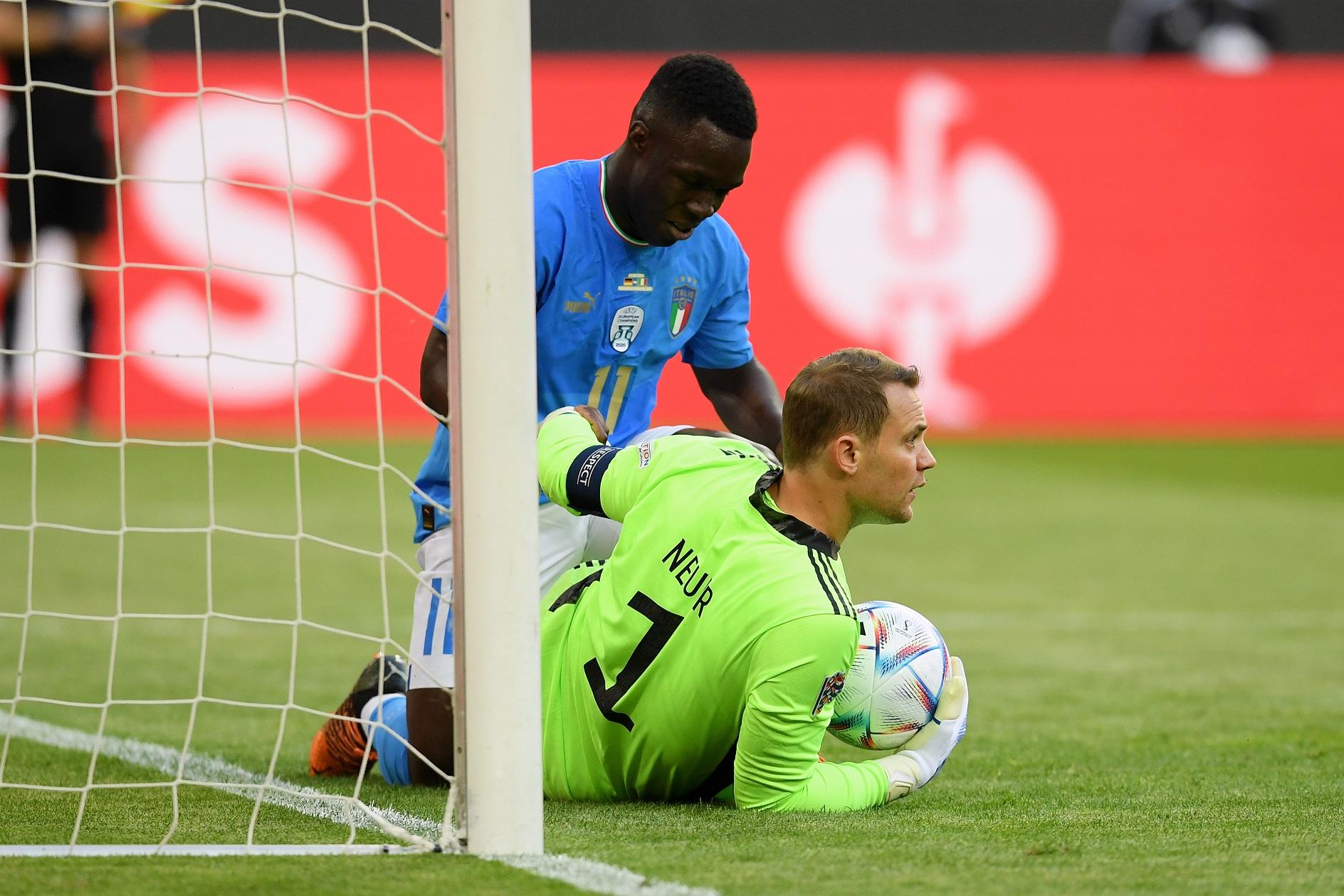 MOENCHENGLADBACH, GERMANY - JUNE 14: Manuel Neuer of Germany is challenged by Degnand Wilfried Gnonto of Italy whilst making a save during the UEFA Nations League League A Group 3 match between Germany and Italy at Borussia Park Stadium on June 14, 2022 in Moenchengladbach, Germany. (Photo by Claudio Villa/Getty Images)