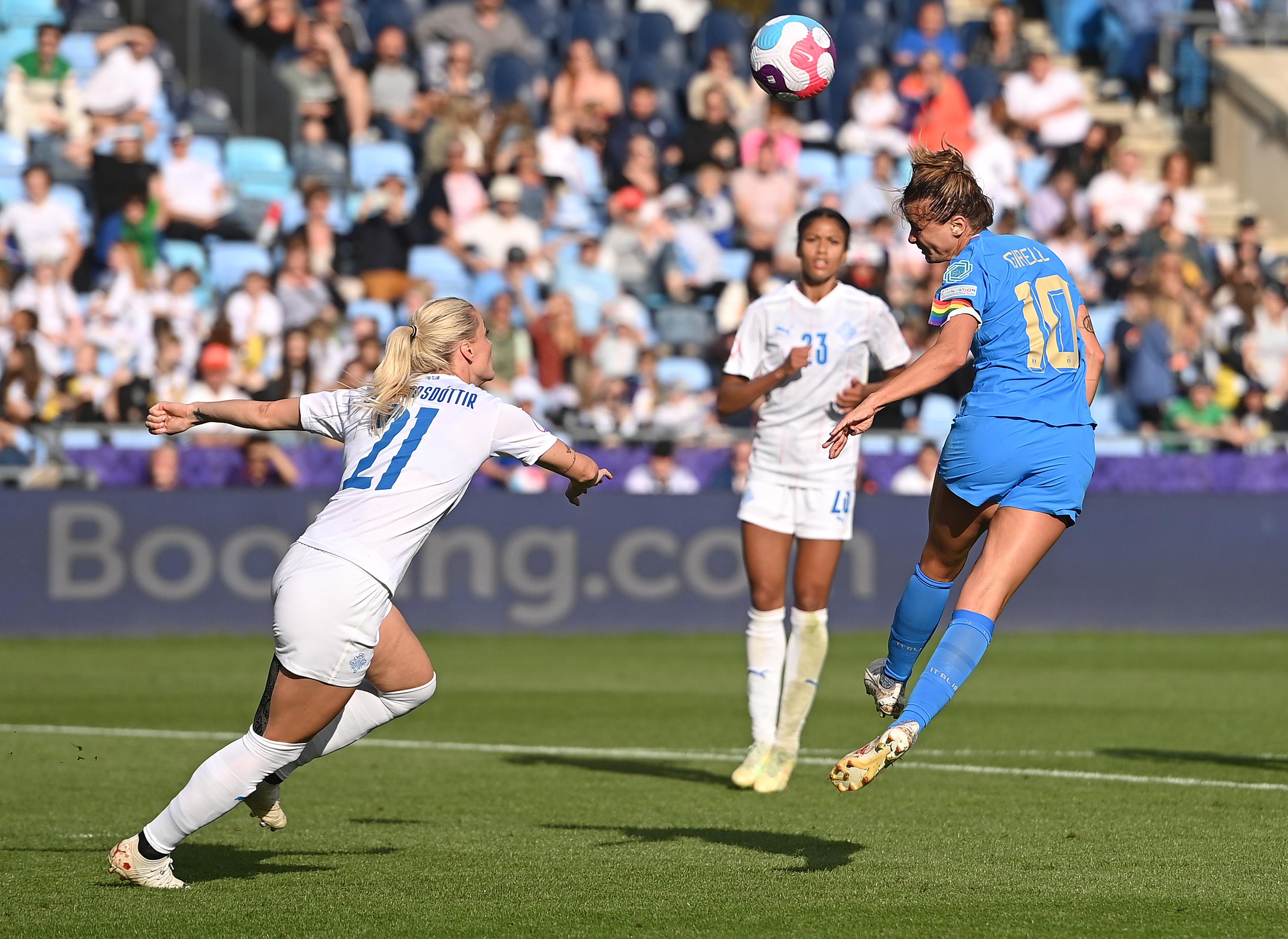 MANCHESTER, ENGLAND - JULY 14: Cristiana Girelli of Italy is challenged by Svava Gudmundsdottir of Iceland during the UEFA Women's Euro 2022 group D match between Italy and Iceland at Manchester City Academy Stadium on July 14, 2022 in Manchester, England. (Photo by Tullio M. Puglia/Getty Images)