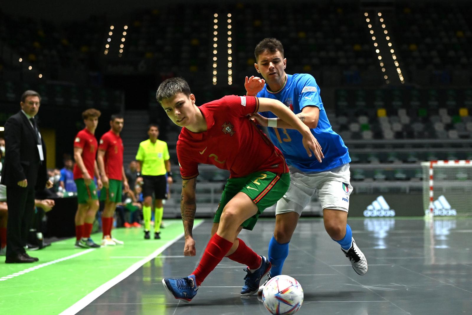 JA\\u00C9N, SPAIN - SEPTEMBER 7: R\\u00FAben Teixeira of Portugal in action against Marco Rosato of Italy during the UEFA Under-19 Futsal EURO 2022 match between Italy and Portugal at the Olivo Arena on September 7, 2022 in Ja\\u00E9n, Spain. (Photo by Harry Murphy - UEFA/UEFA via Sportsfile)