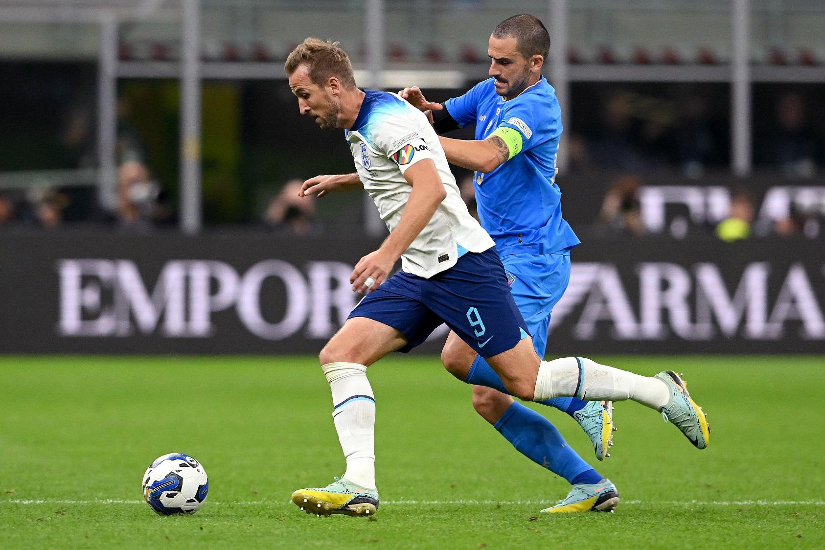 MILAN, ITALY - SEPTEMBER 23: Harry Kane of England battles for possession with Leonardo Bonucci of Italy during the UEFA Nations League League A Group 3 match between Italy and England at San Siro on September 23, 2022 in Milan, Italy. (Photo by Claudio Villa/Getty Images)