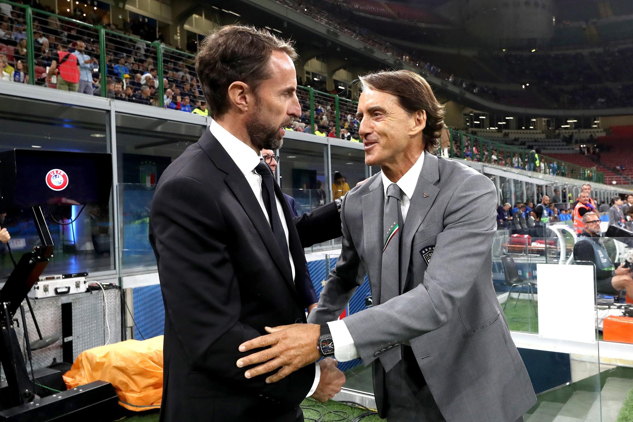 MILAN, ITALY - SEPTEMBER 23: Gareth Southgate, Manager of England shakes hands with Roberto Mancini, Head Coach of Italy, prior to kick off of the UEFA Nations League League A Group 3 match between Italy and England at San Siro on September 23, 2022 in Milan, Italy. (Photo by Marco Luzzani/Getty Images)