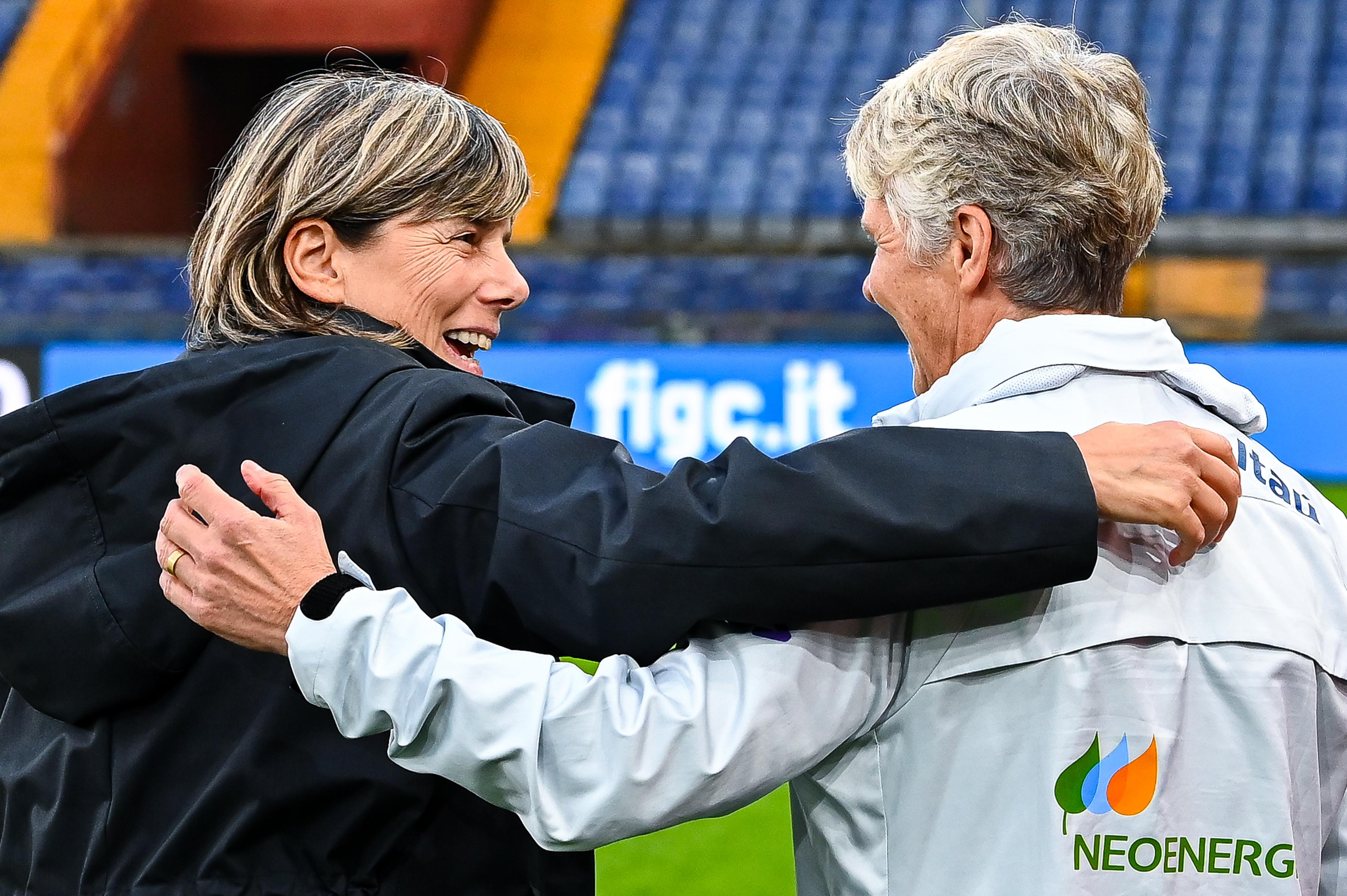 GENOA, ITALY - OCTOBER 10: Milena Bertolini head coach of Italy (L) greets Pia Sundhage head coach of Brazil prior to kick-off in the Women’s International Friendly match between Italy and Brazil at Stadio Luigi Ferraris on October 10, 2022 in Genoa, Italy. (Photo by Simone Arveda/Getty Images)